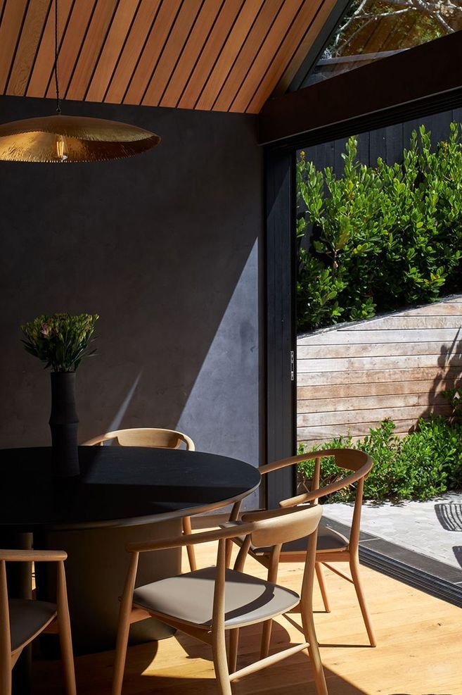 Suave polished plaster in Beautiful Black was selected for the walls of this England Street home, adding movement and framing the garden view.