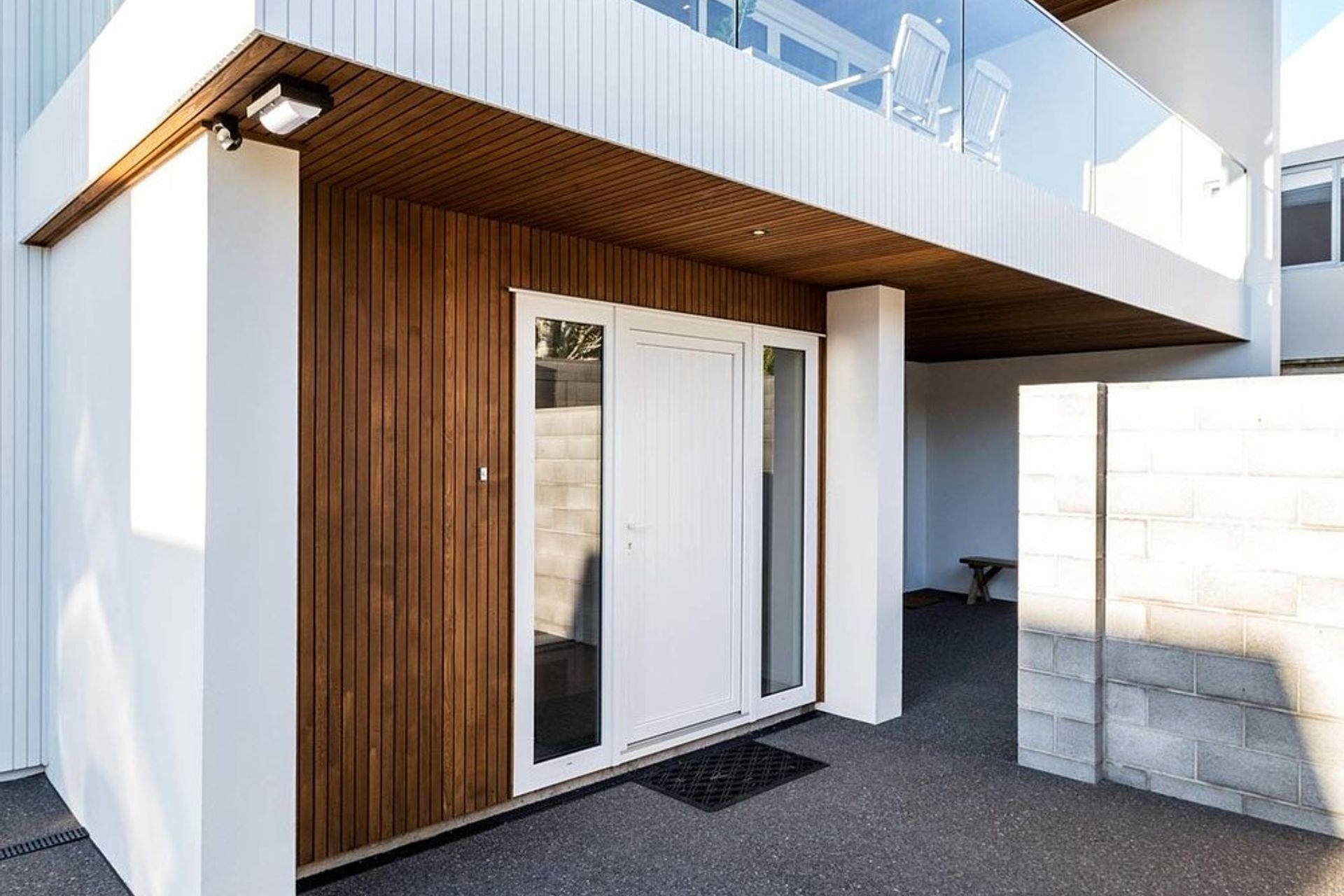 Window panels on either side of an entry door gives a nice feeling of symmetry