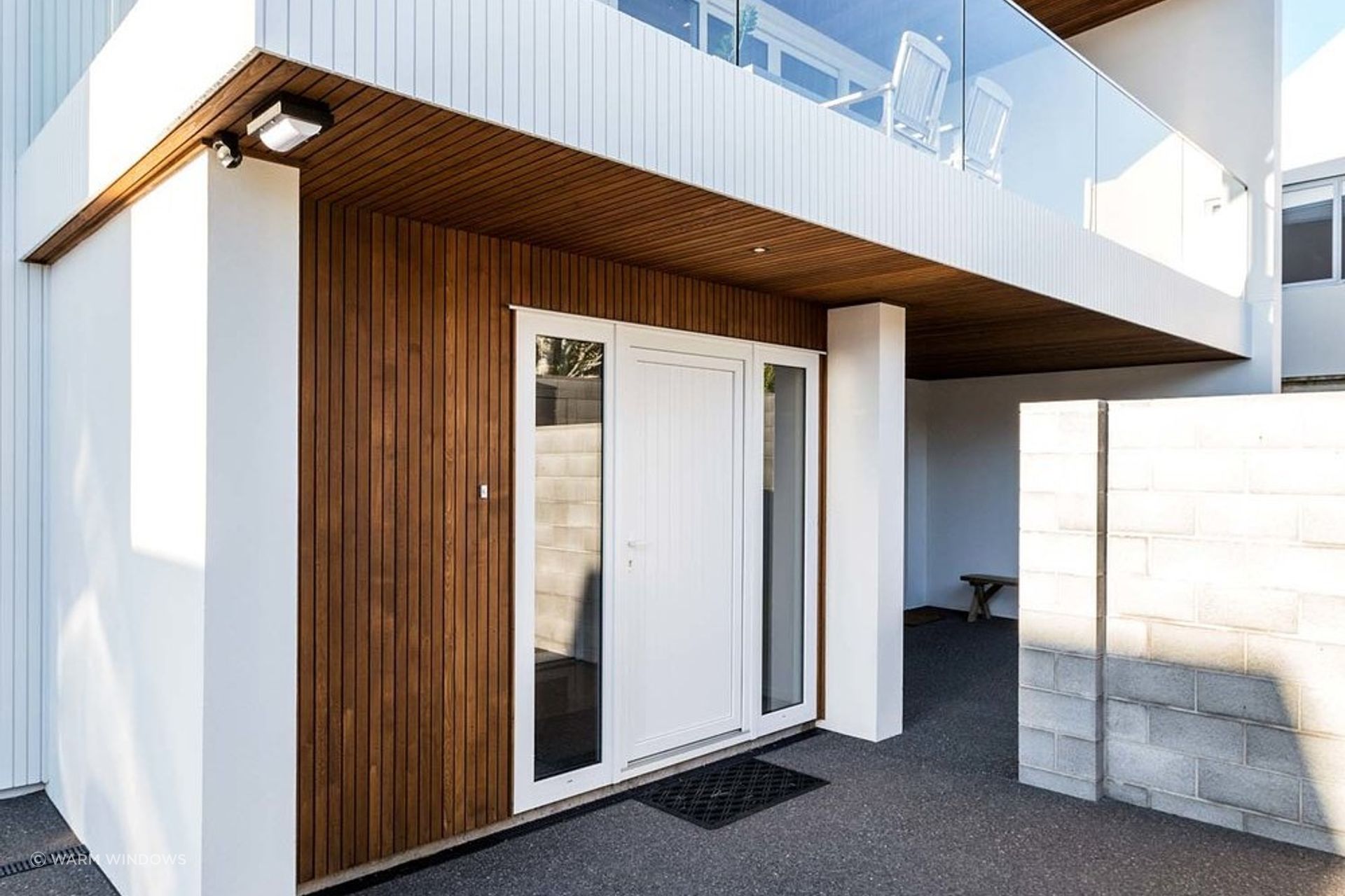 Window panels on either side of an entry door gives a nice feeling of symmetry