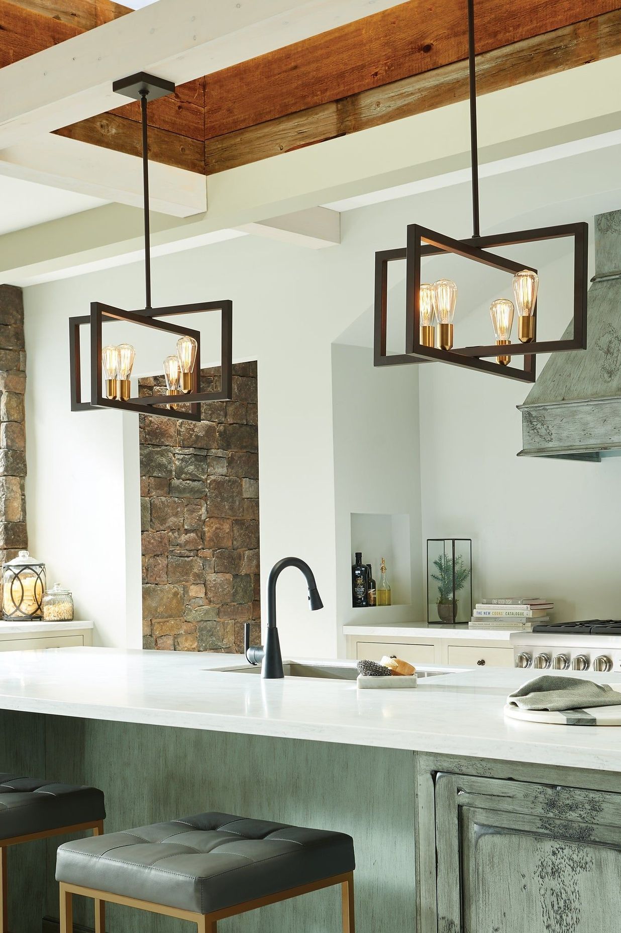 These lights create an inviting atmosphere in this kitchen. Featured product: Finnegan Large Pendant by Urban Lighting.