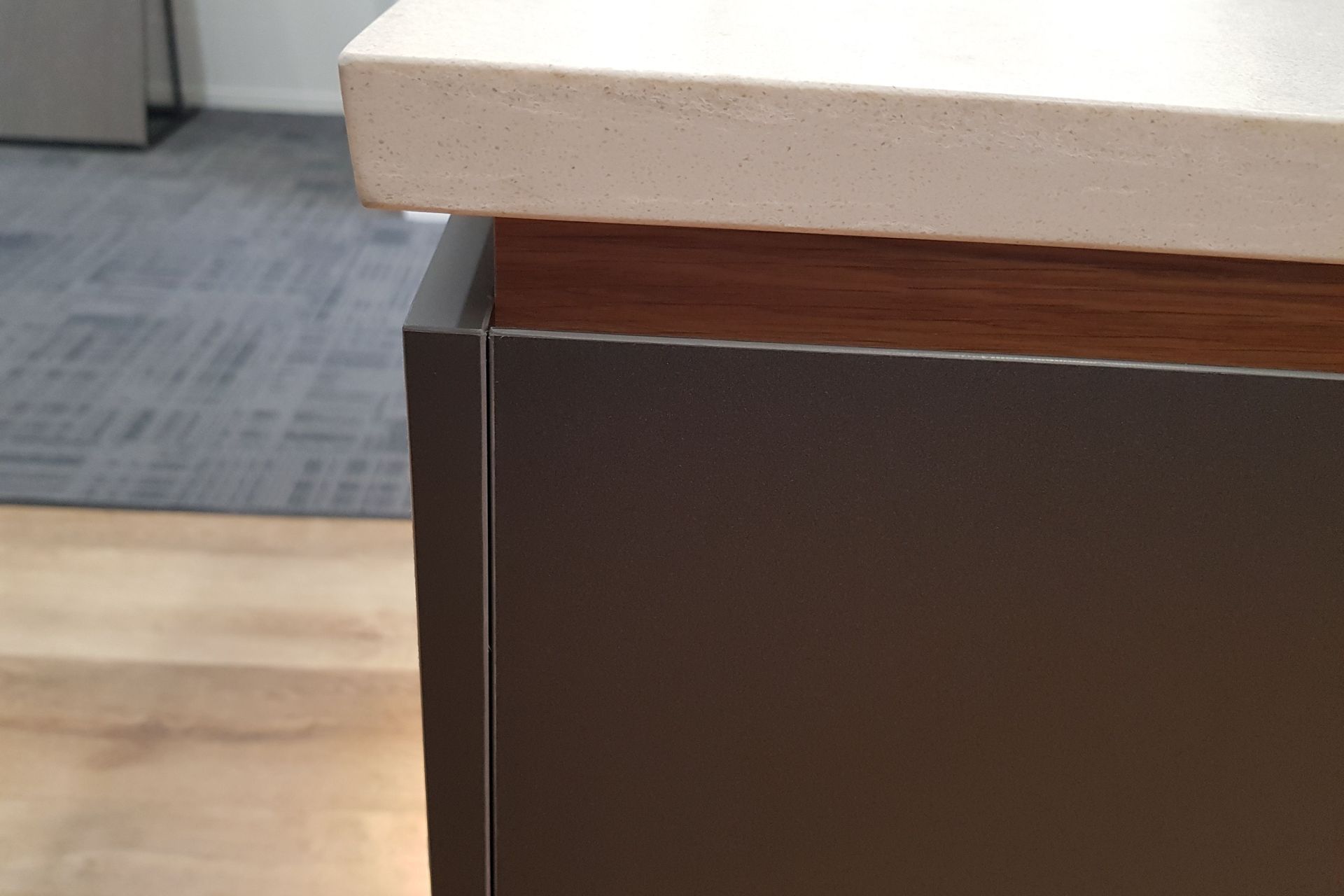 Premium Acrylic panels on MDF boards for all the cabinet and drawer fronts. Recessed Veneer below the stone engineered countertop gives the benchtop an appearance of floating.