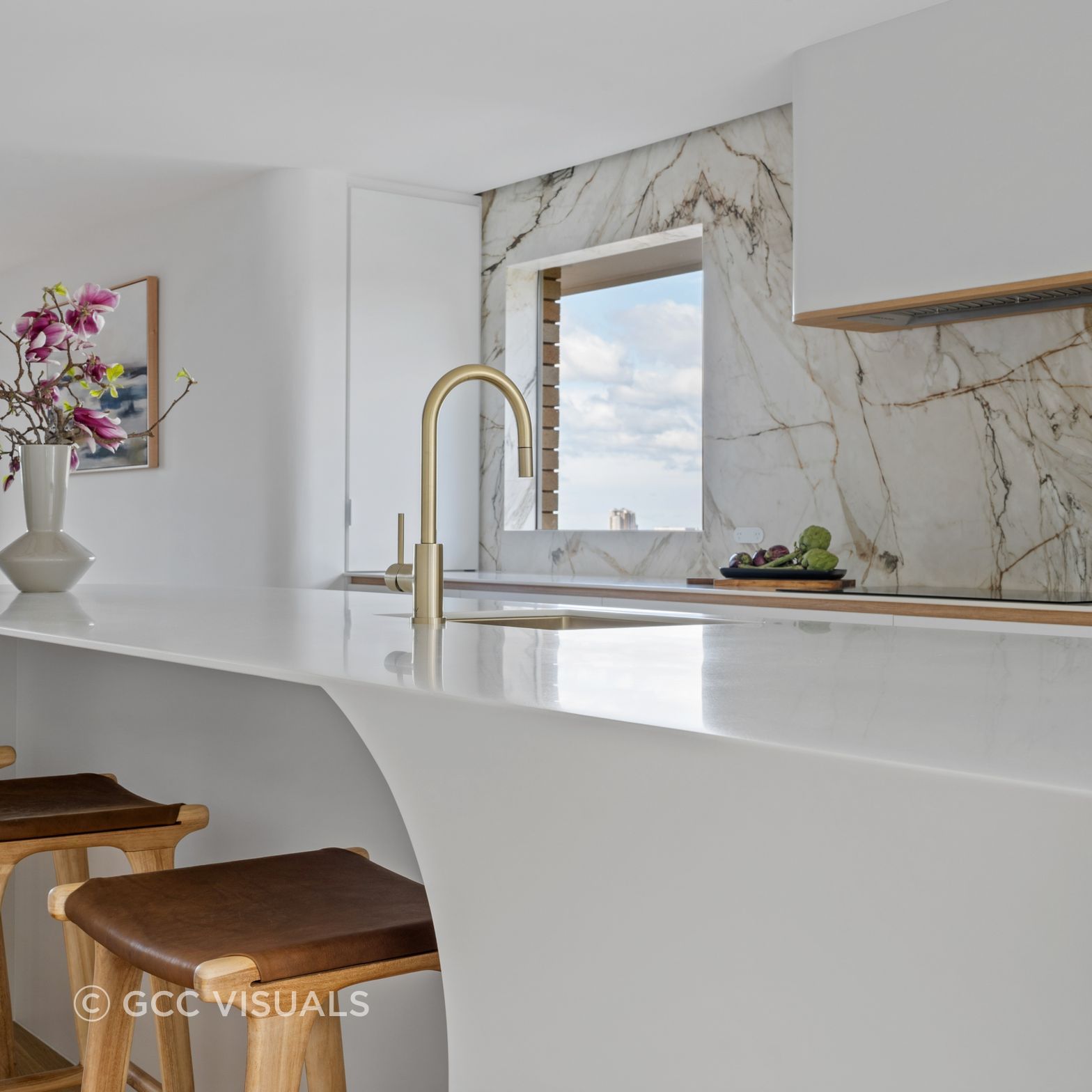 The Avenue. Coastal inspired living. Warm neutral palette, Corian curved statement island and Neolith feature stone.