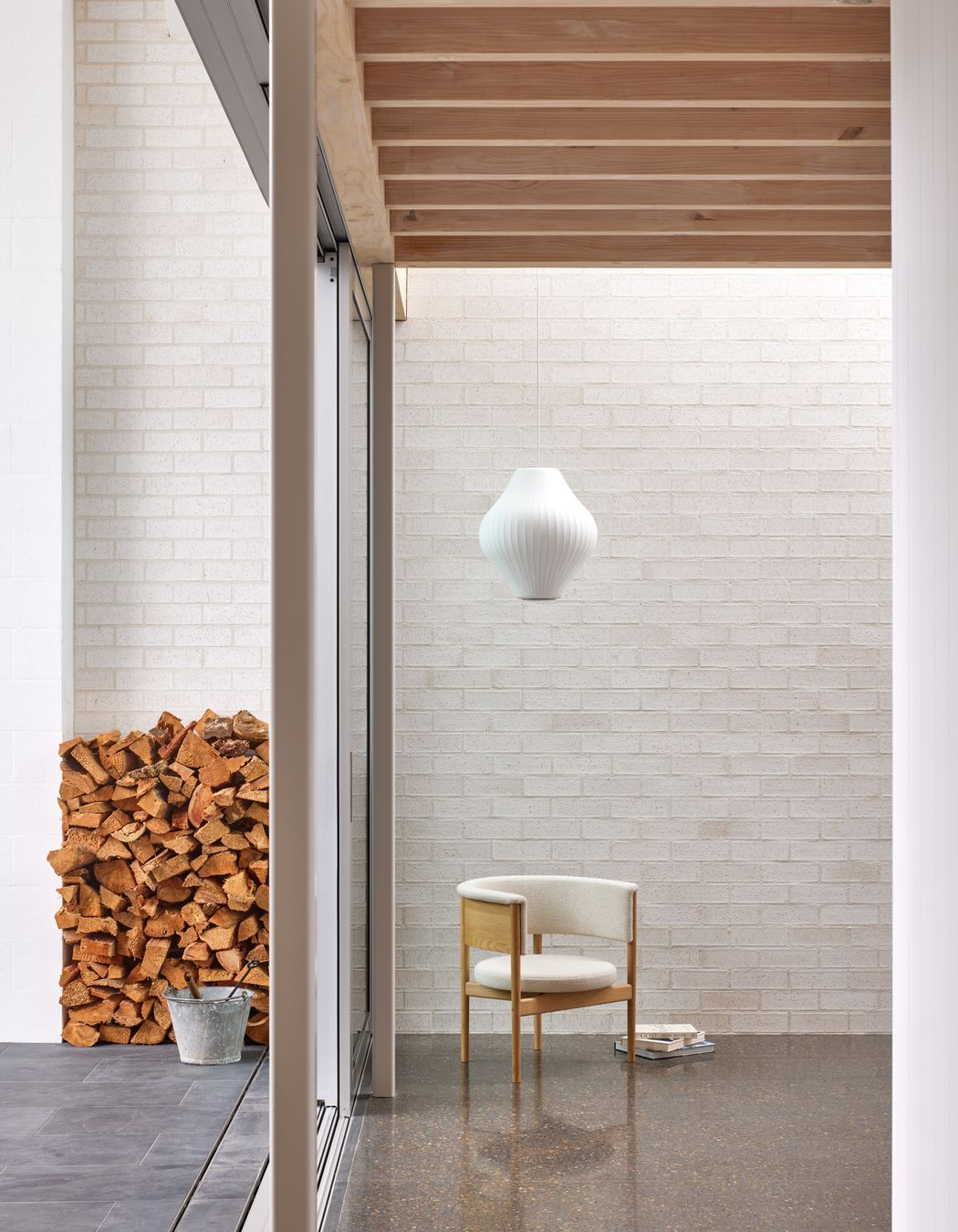 Point House by Guy Tarrant Architects with furniture from Good Form – N-CC01 Lounge Chair by Karimoku Case