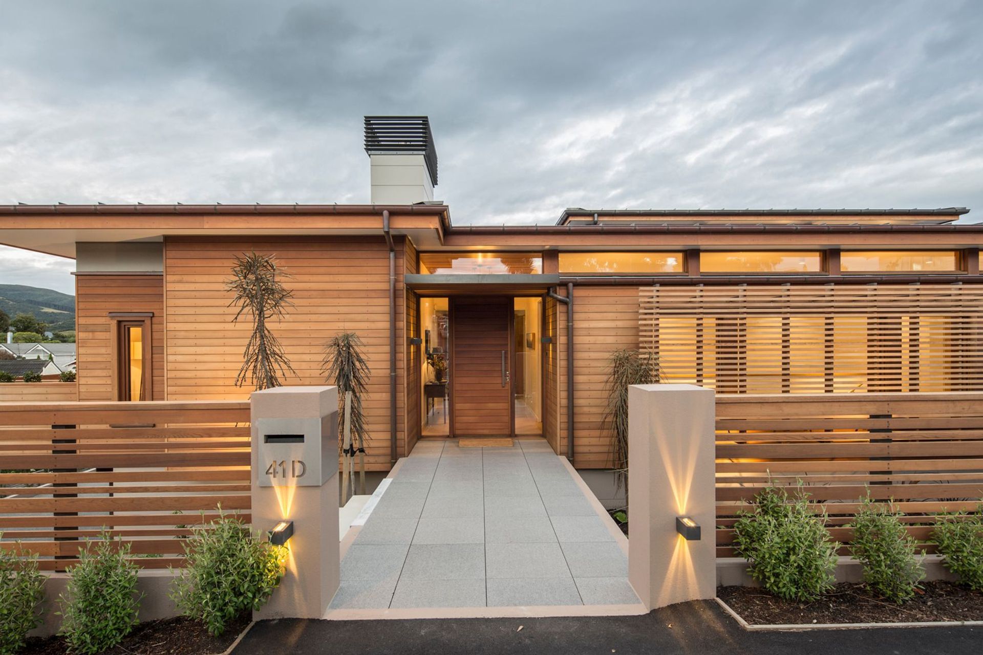 Horizontal cladding on this front door maintains the design theme of this residence in Maori Hill, Dunedin