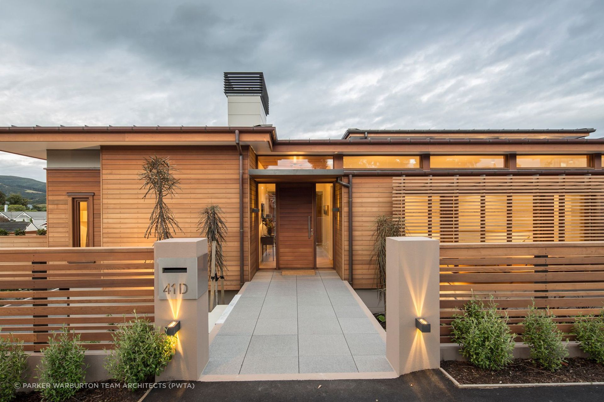 Horizontal cladding on this front door maintains the design theme of this residence in Maori Hill, Dunedin