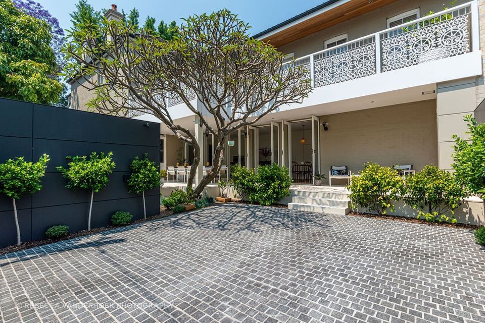 Charcoal Granite Cobblestones | Gardner Design & Construction