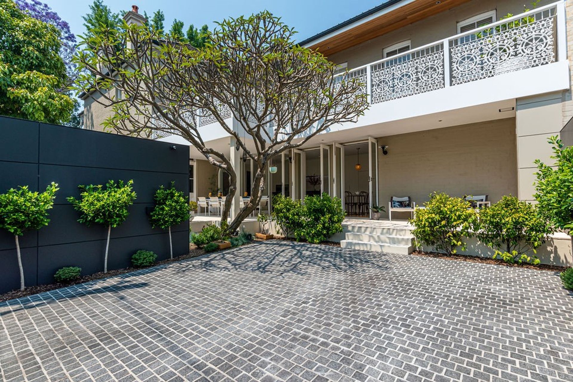 Charcoal Granite Cobblestones | Gardner Design & Construction