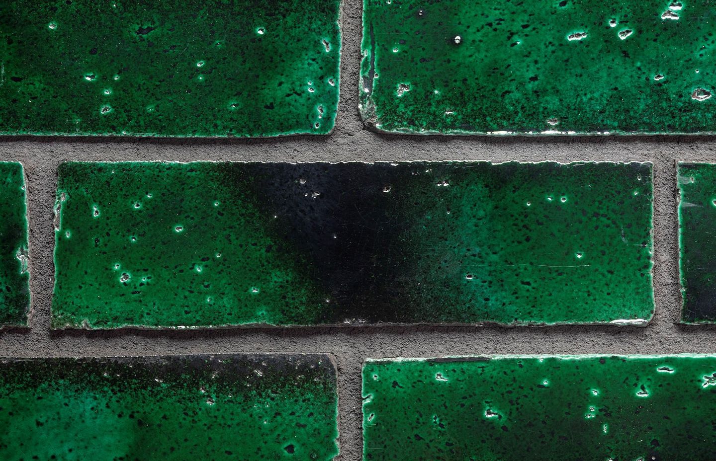 A close up of The Greenhouse's unique iridescent bricks.