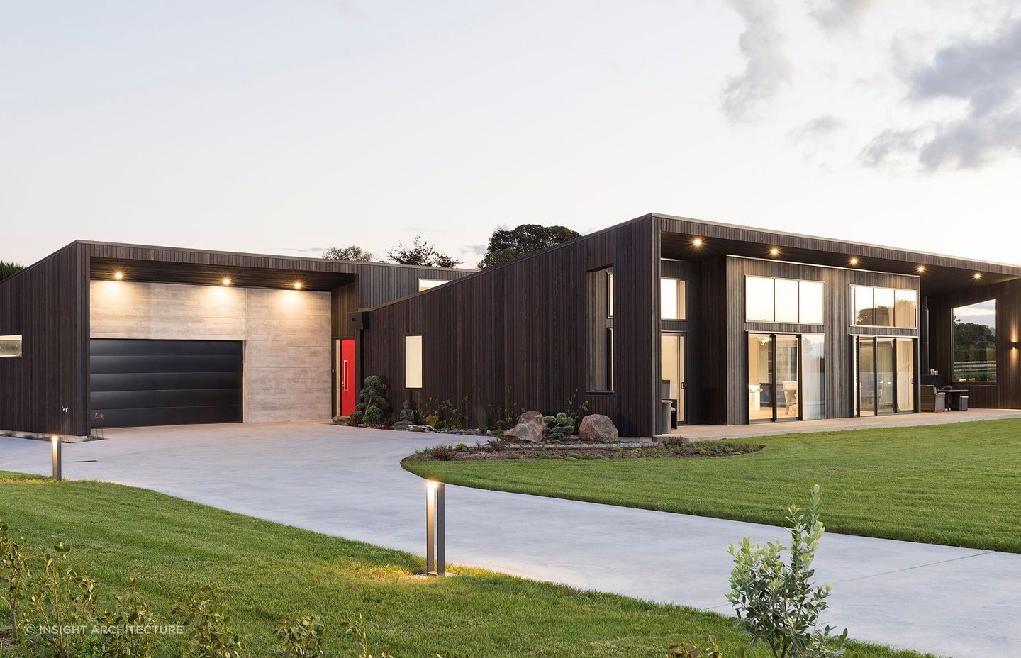 Dark stained weatherboards create a striking scene with this contemporary Tauranga home