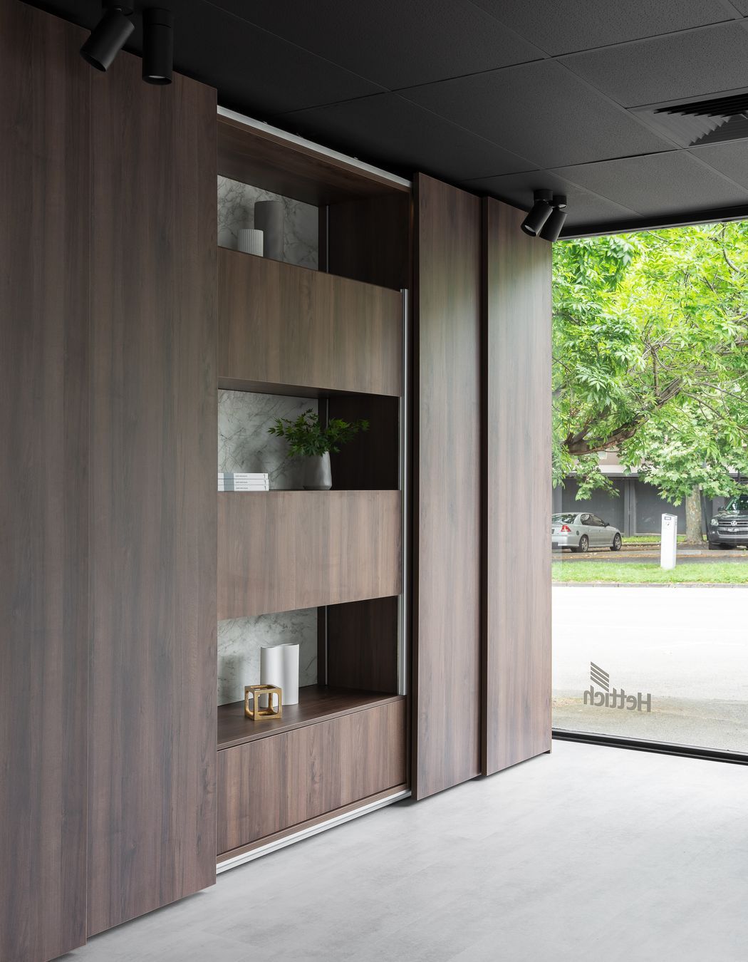 AvanTech YOU drawers can also be found behind the large TopLine XL sliding doors as a shining example of bedroom storage application.