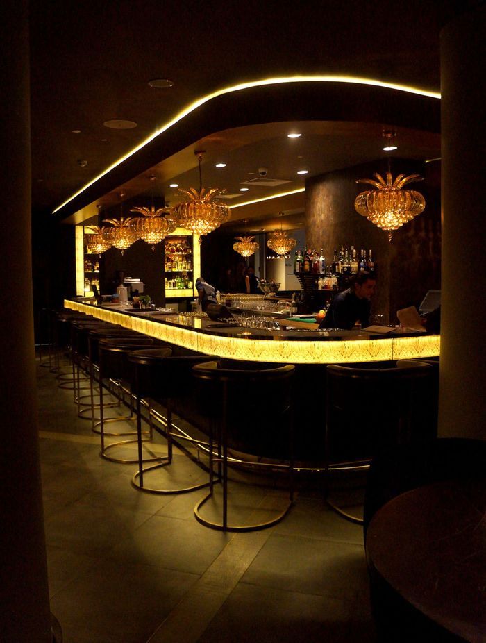 Darkarts Studios created a dark and moody lighting plan for the Hilton's Sky Bar, designed to reduce window reflection.