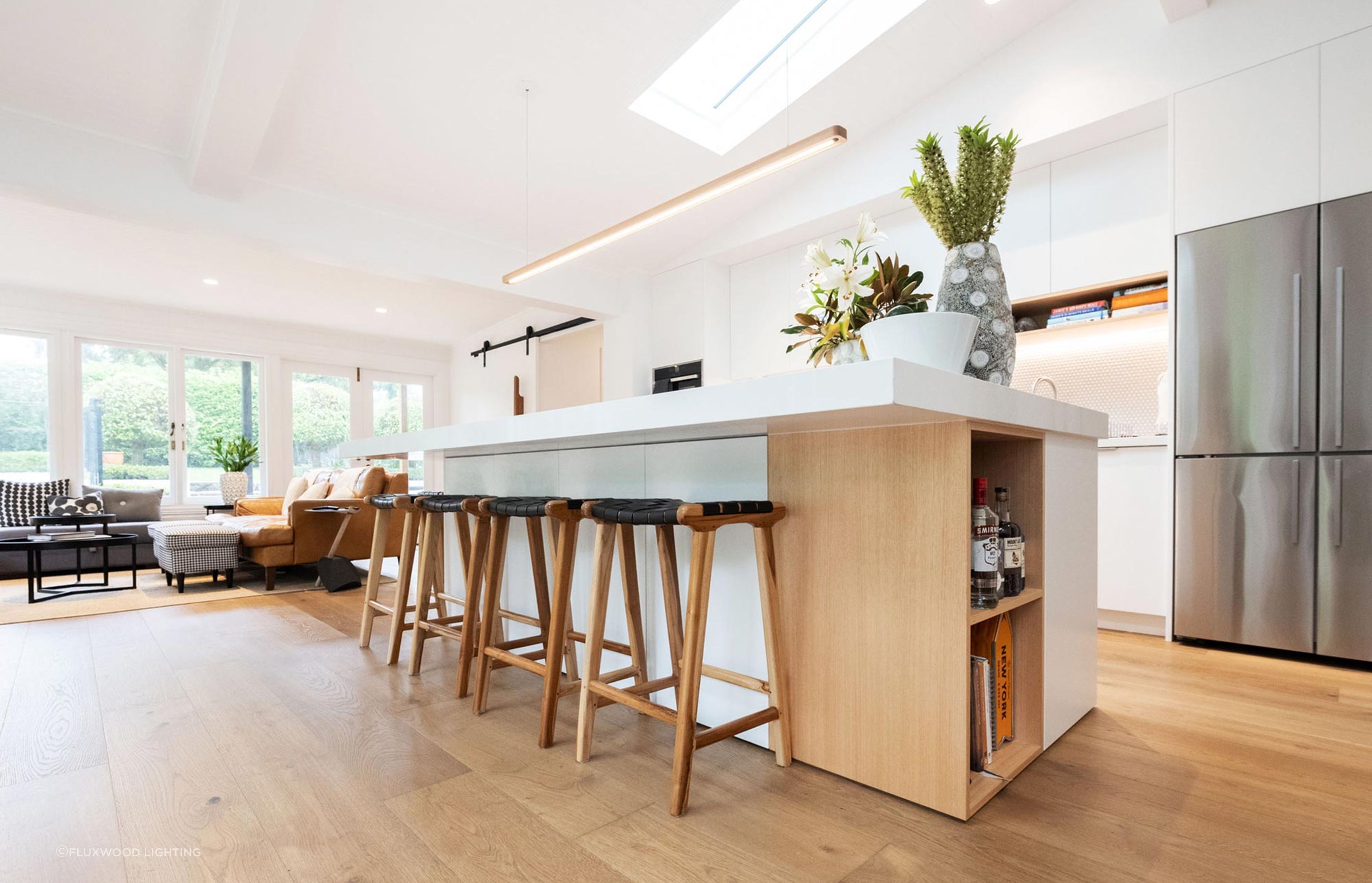 This minimalist LED strip light hangs gracefully over the kitchen island. Featured product: Hollow Pendant