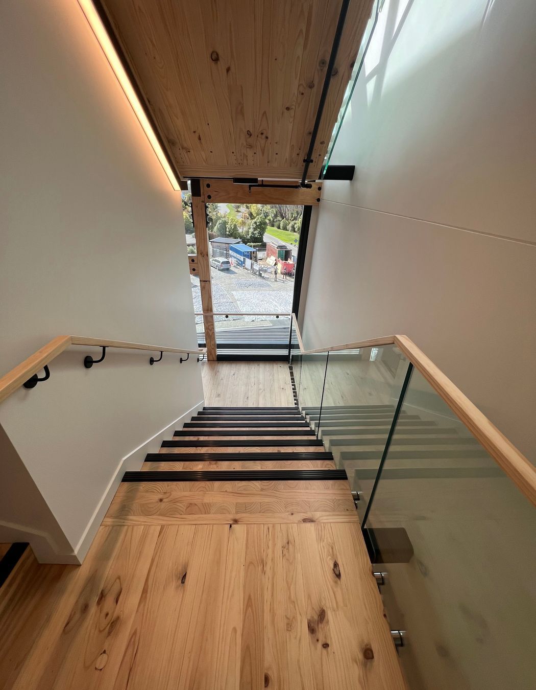 The stairwell also features beautiful timber floors and exposed LVL beams.