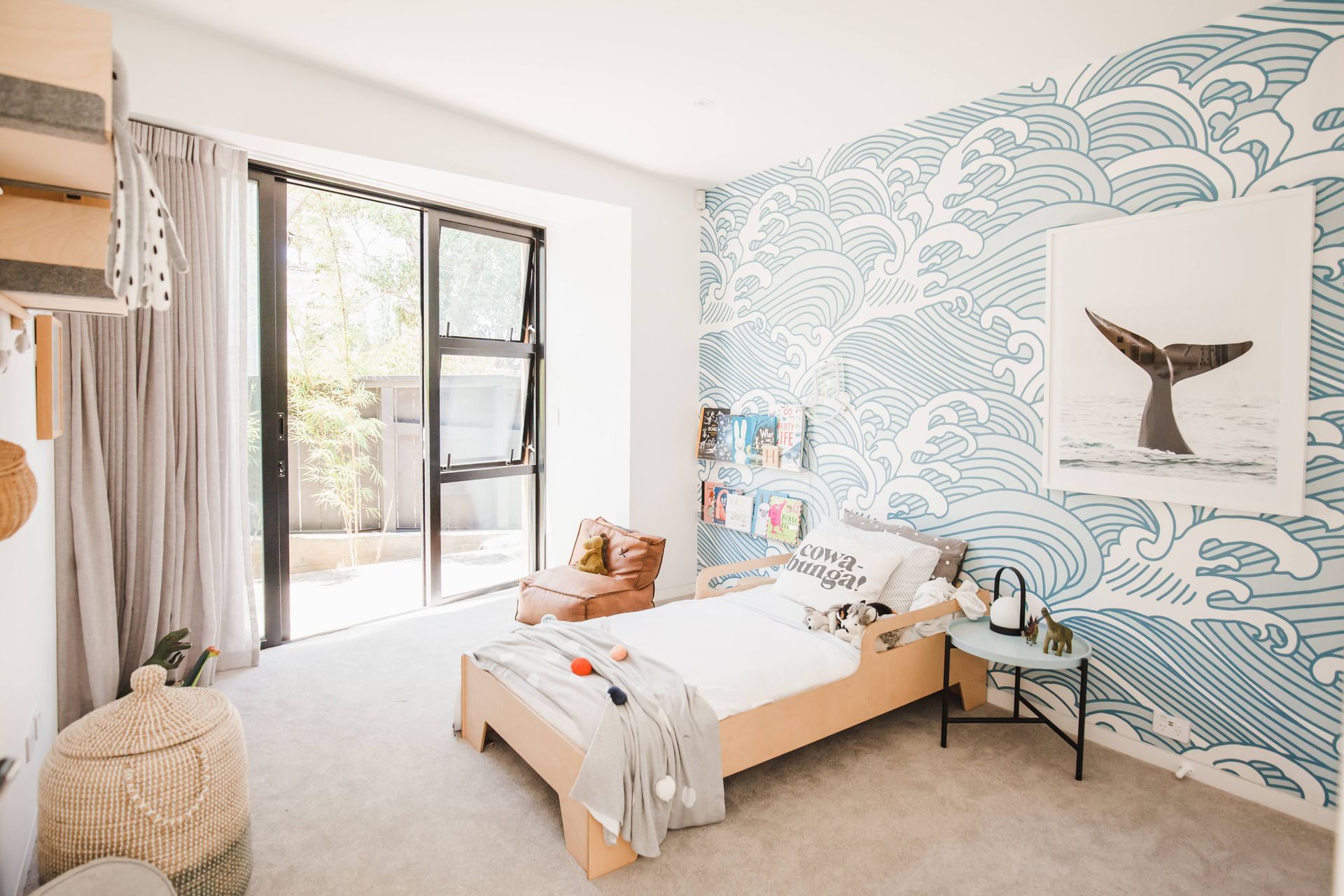 Ocean-themed wallpaper and the Plyhome Junior Bed by Plyhome are a perfect combination in the youngest son's bedroom.