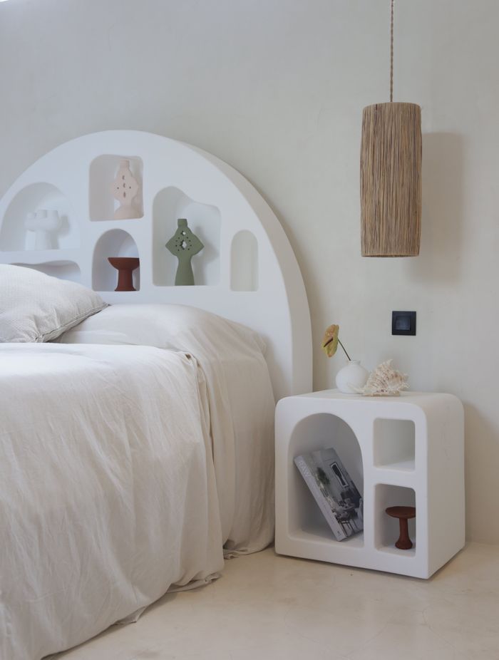 A minimalist bedroom with a clean interior design is a great setting for a Mediterranean bedside table. Featured product: Mykonos Side Table.