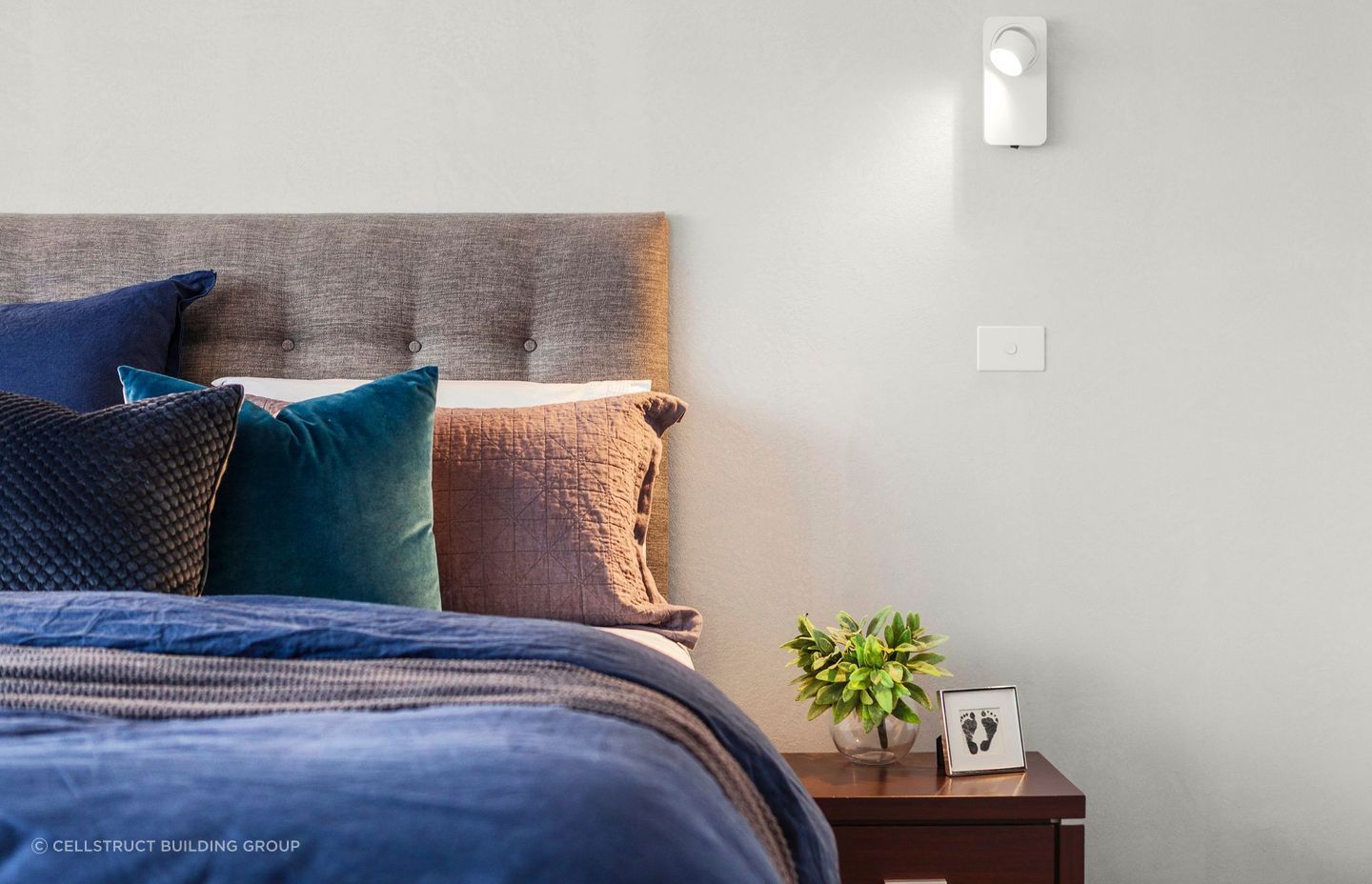 Pillows come in a wide range of materials and fills, arranged stylishly together in the bedroom of a stunning townhouse | Photography: Grant Kennedy