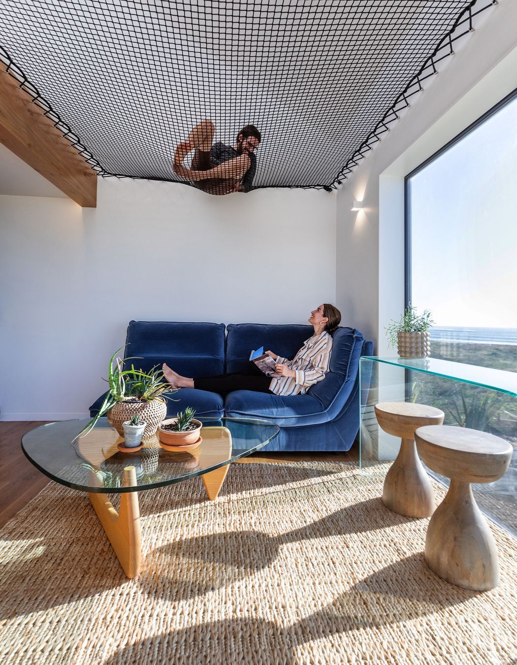 Homeowners Matthieu and Maria, lounging in the smaller pod. | Photographer: Sandra Henderson