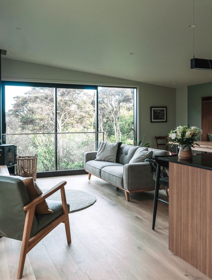 The living room has a slider with a Juliet balcony, which when open gives you the feeling of virtually being in the treetops.