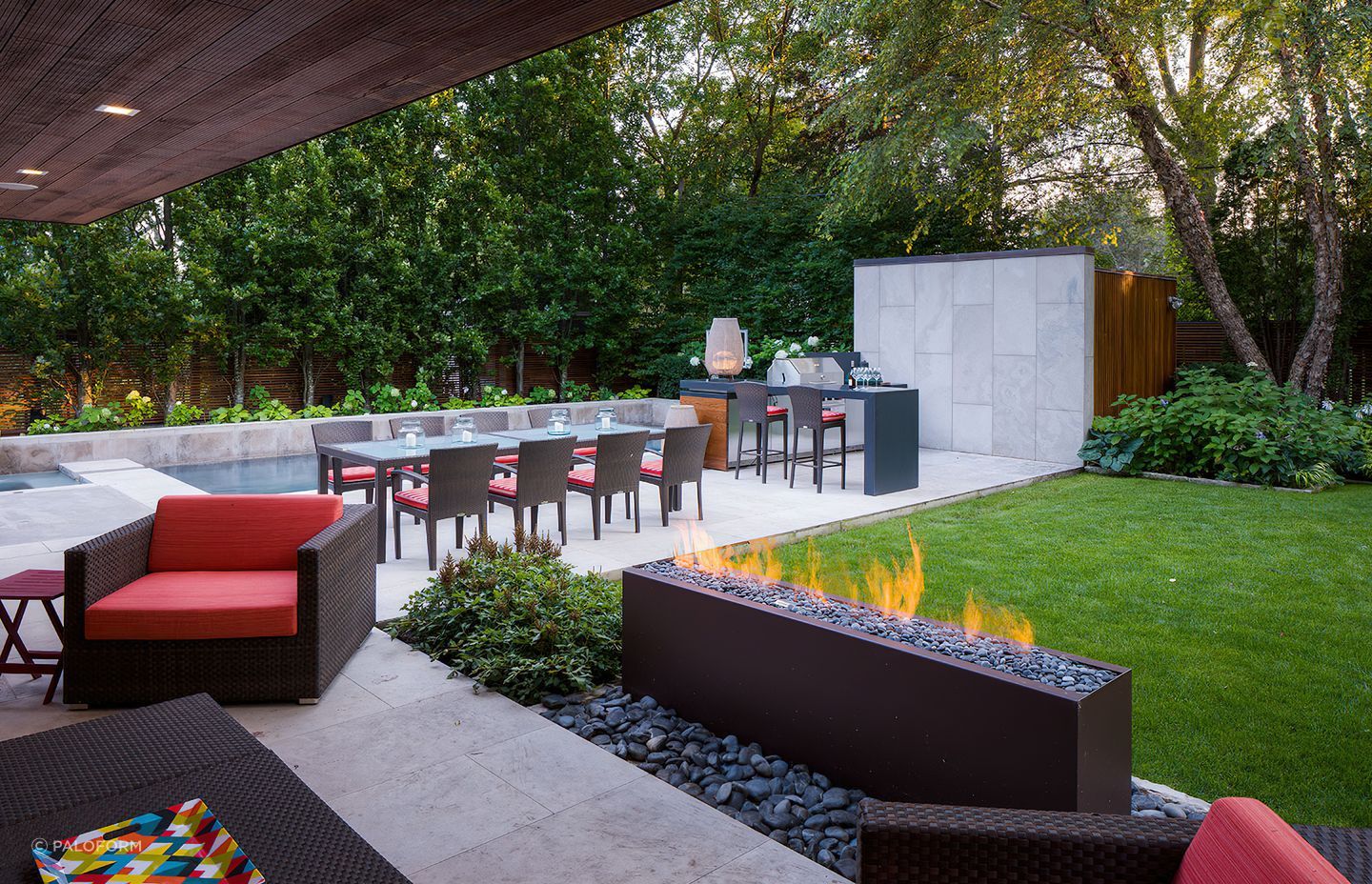 Organic materials like concrete, cedar and large-format stone tiles adorn this immaculate outdoor kitchen