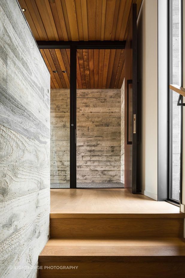 The entryway opens directly to the stair, providing a logical pathway down to the living space below.