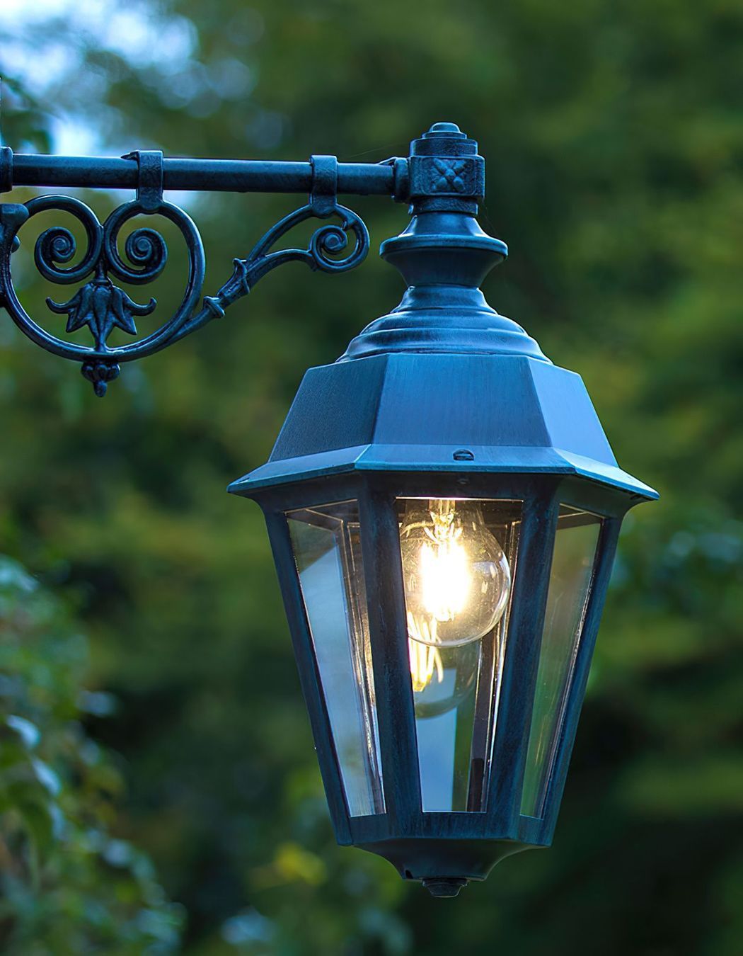 You can use forms of outdoor lighting for different areas of your home's facade.