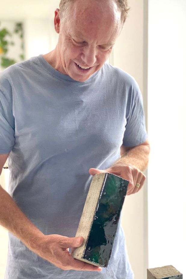 Ockham Residential's CEO Mark Todd inspects bricks from Venetian brickery, Sant' Anselmo.