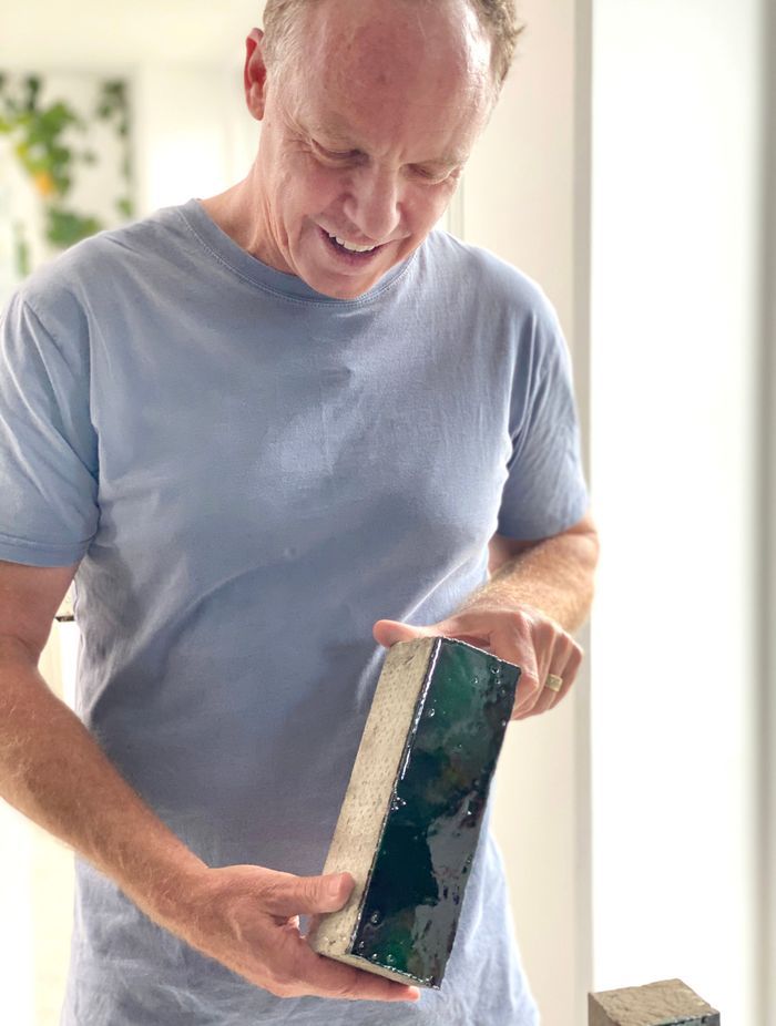 Ockham Residential's CEO Mark Todd inspects bricks from Venetian brickery, Sant' Anselmo.