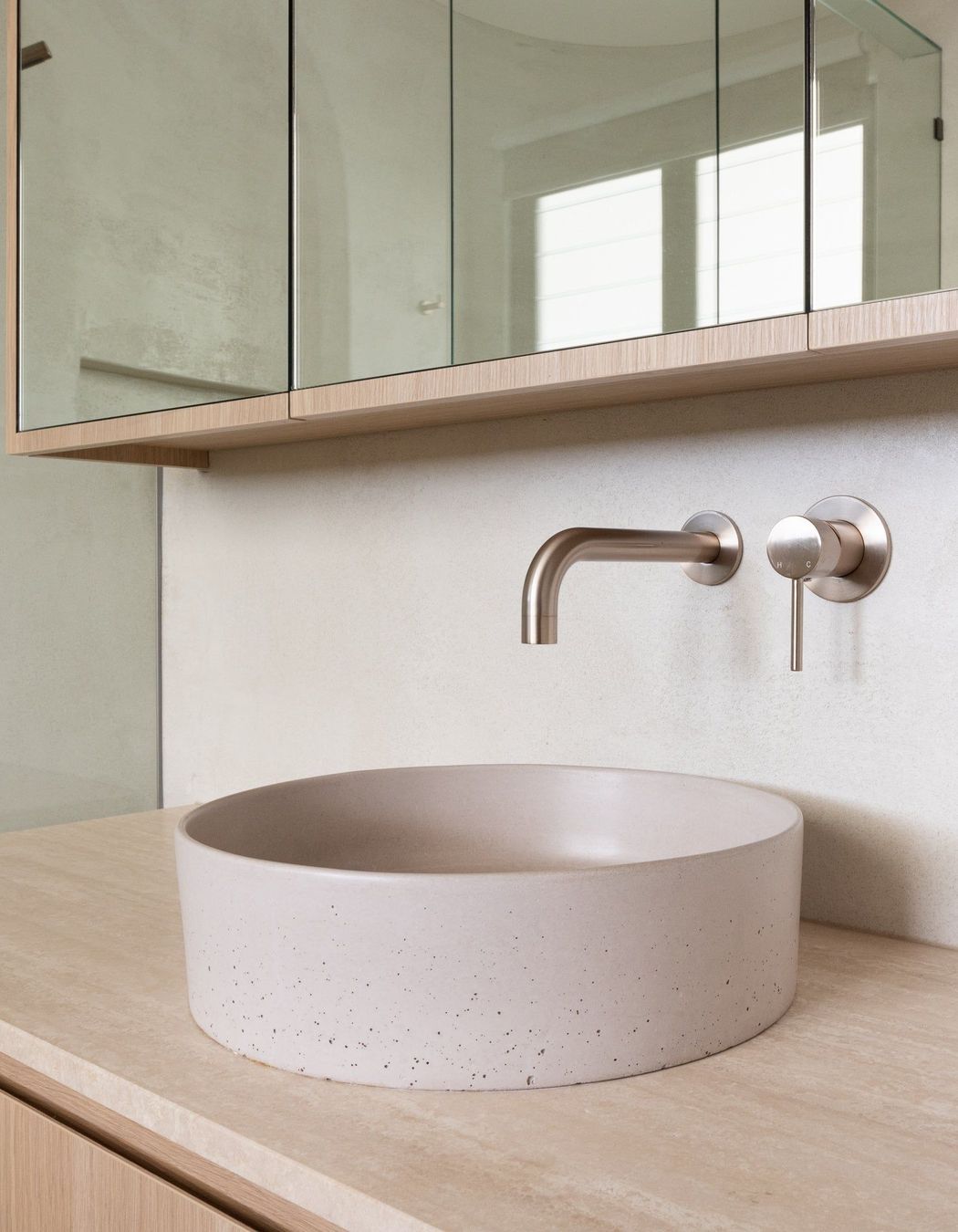Wall-mounted taps fixed directly to the wall offer more space around the basin.