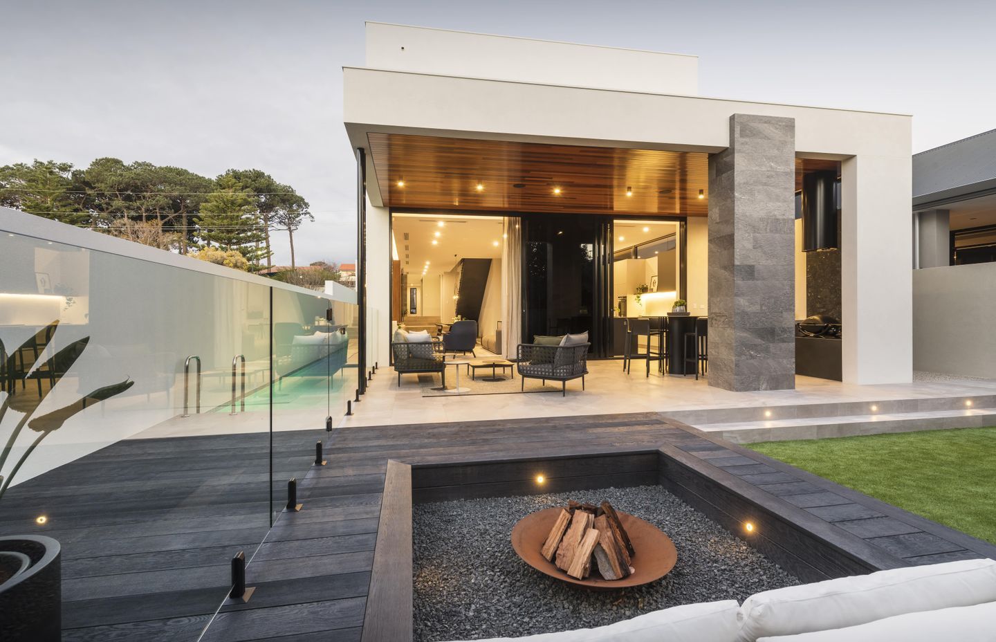 Backyard Fire pit featuring Burnt Cedar with lap pool