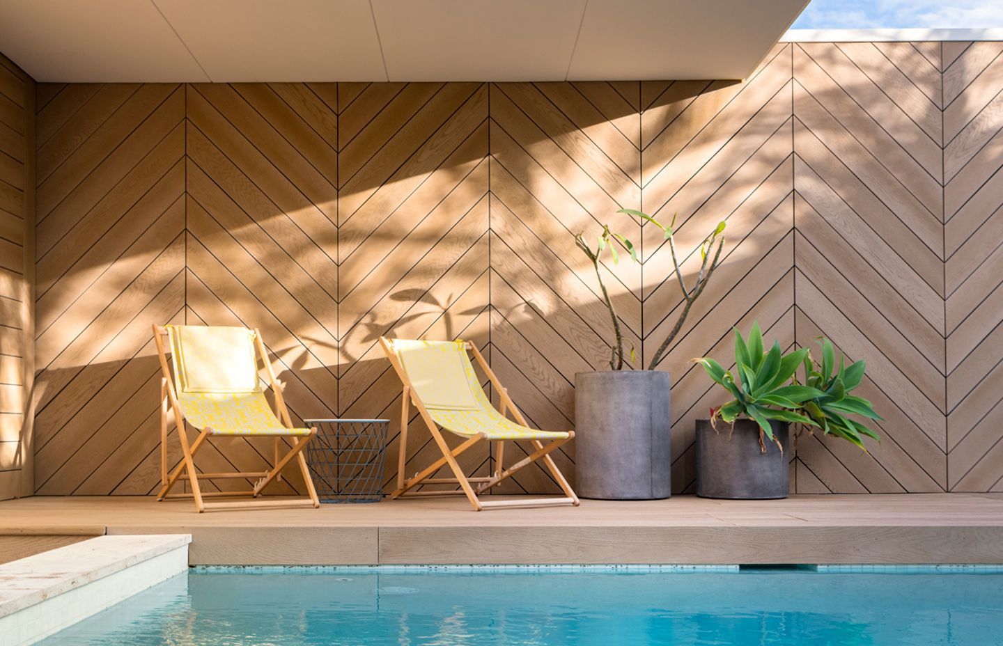 Herringbone style Golden Oak screening around pool deck