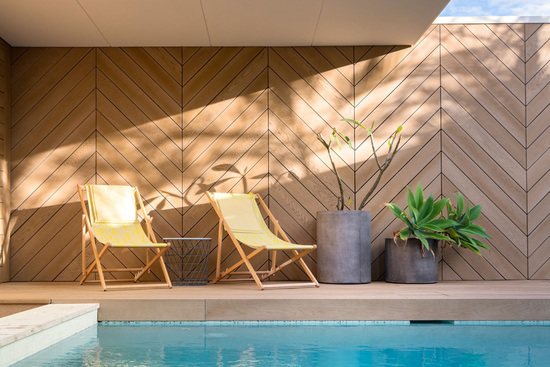 Herringbone style Golden Oak screening around pool deck