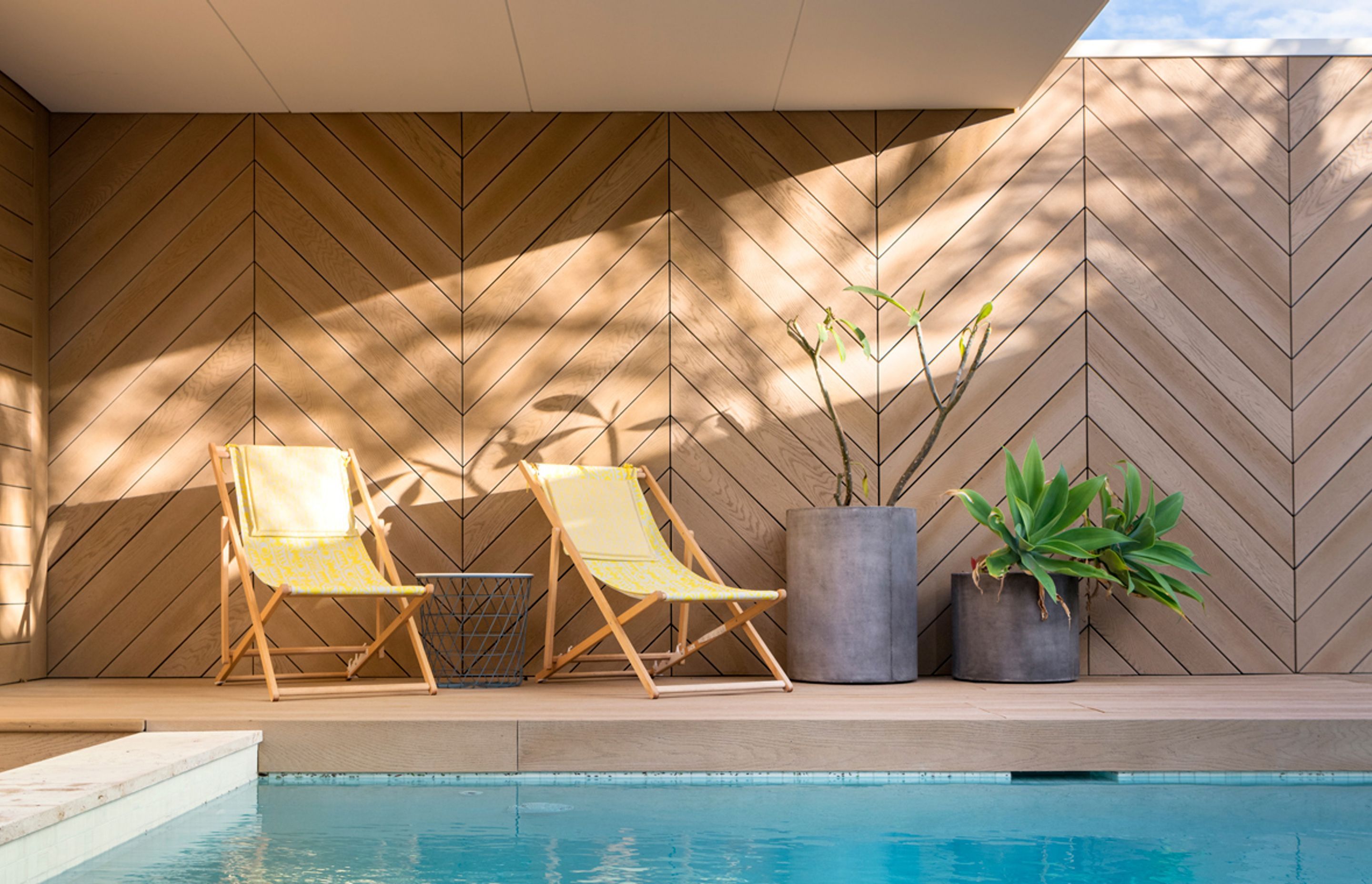 Herringbone style Golden Oak screening around pool deck