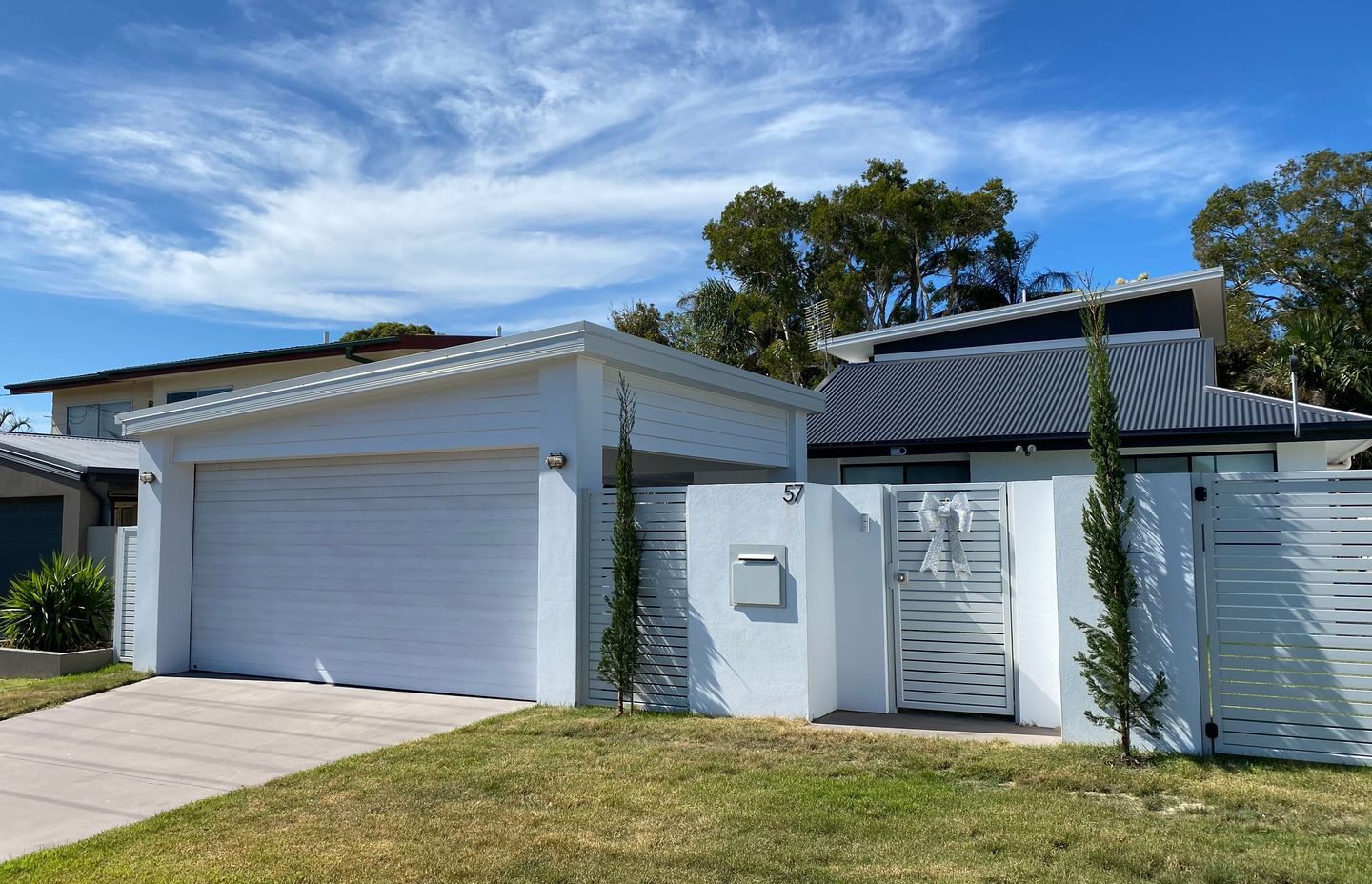 Modern Transformation to 60s Brick and Tile House by BYO Floor Plan