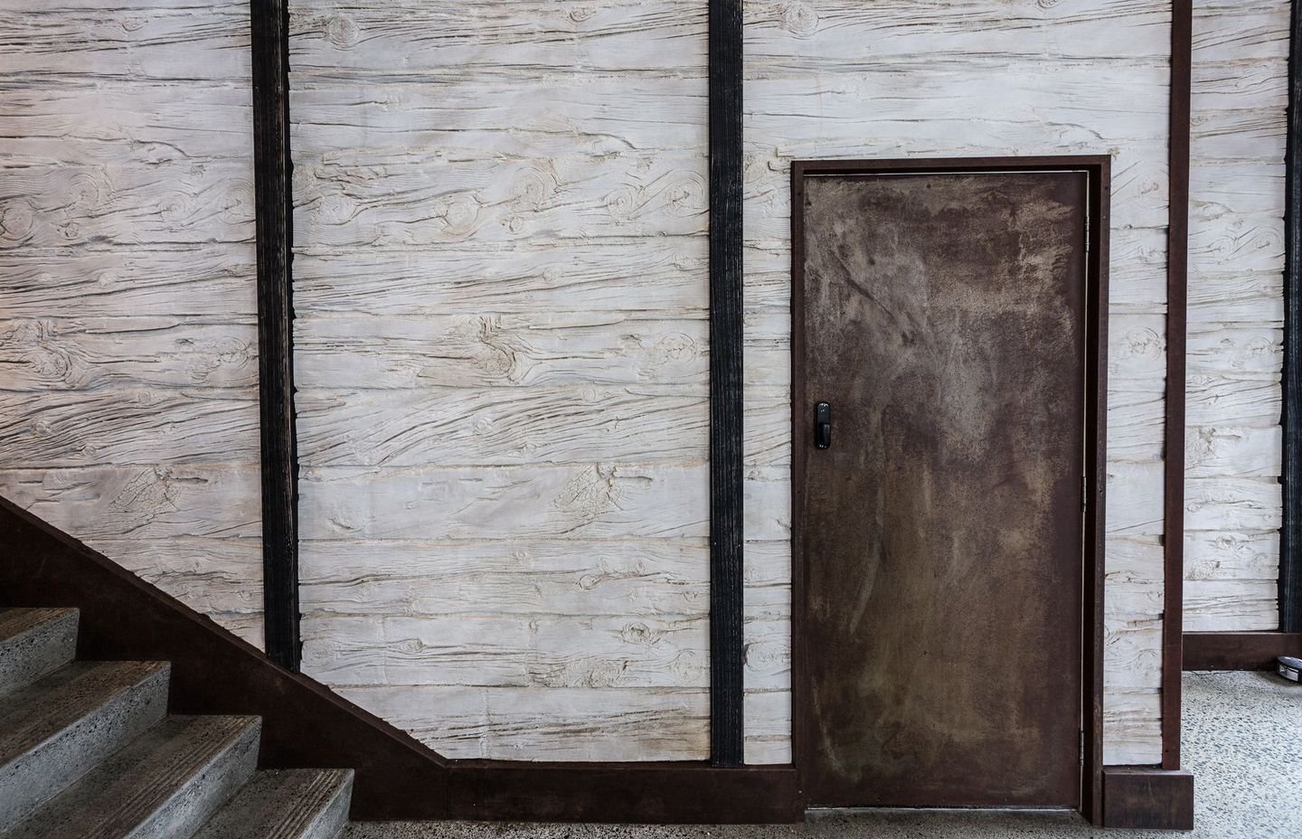 Wooden sleeper wall panels offer a rustic look.