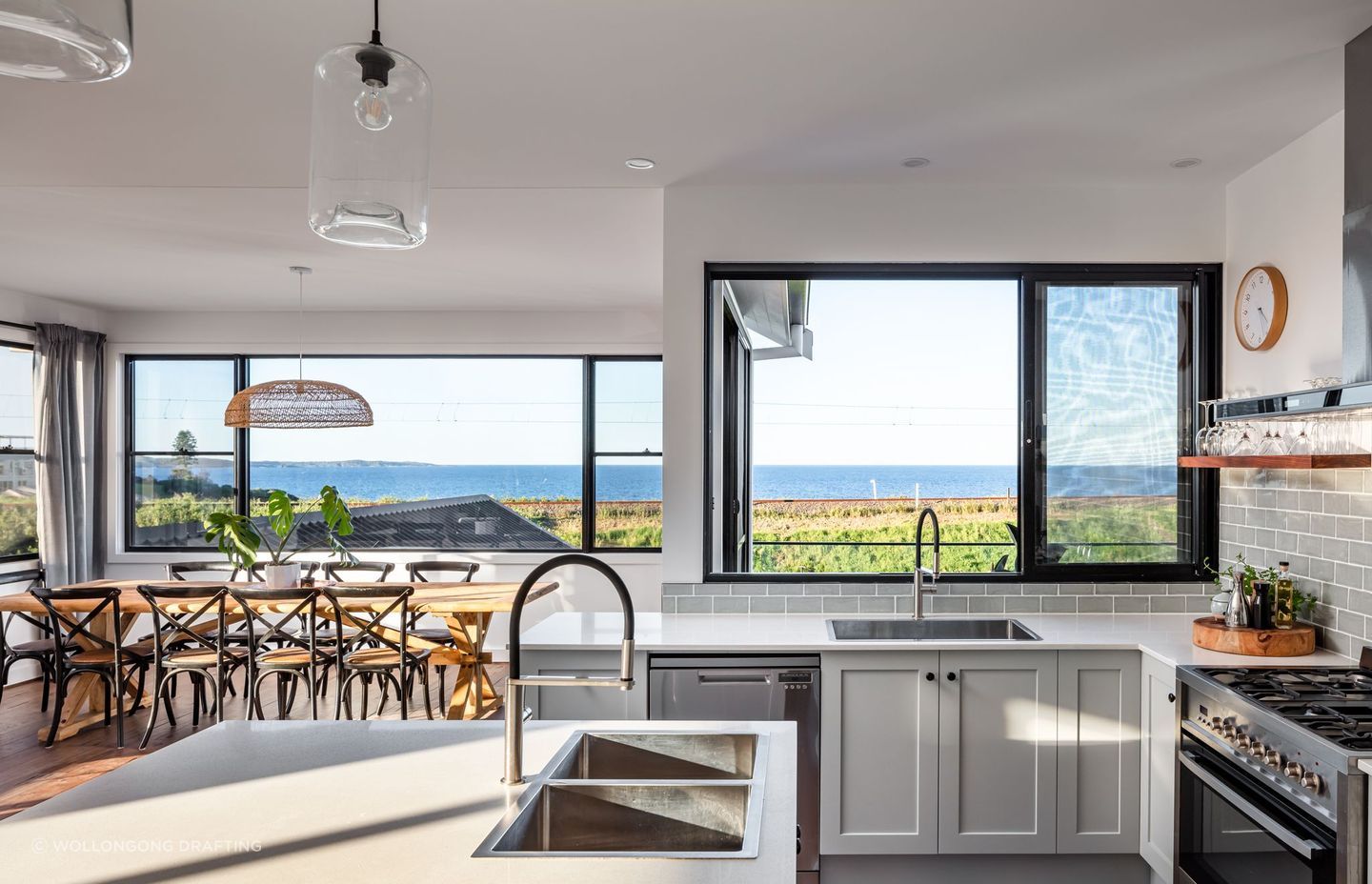 The kitchen and dining area intertwine nicely. Photographer: Shaw Photography.