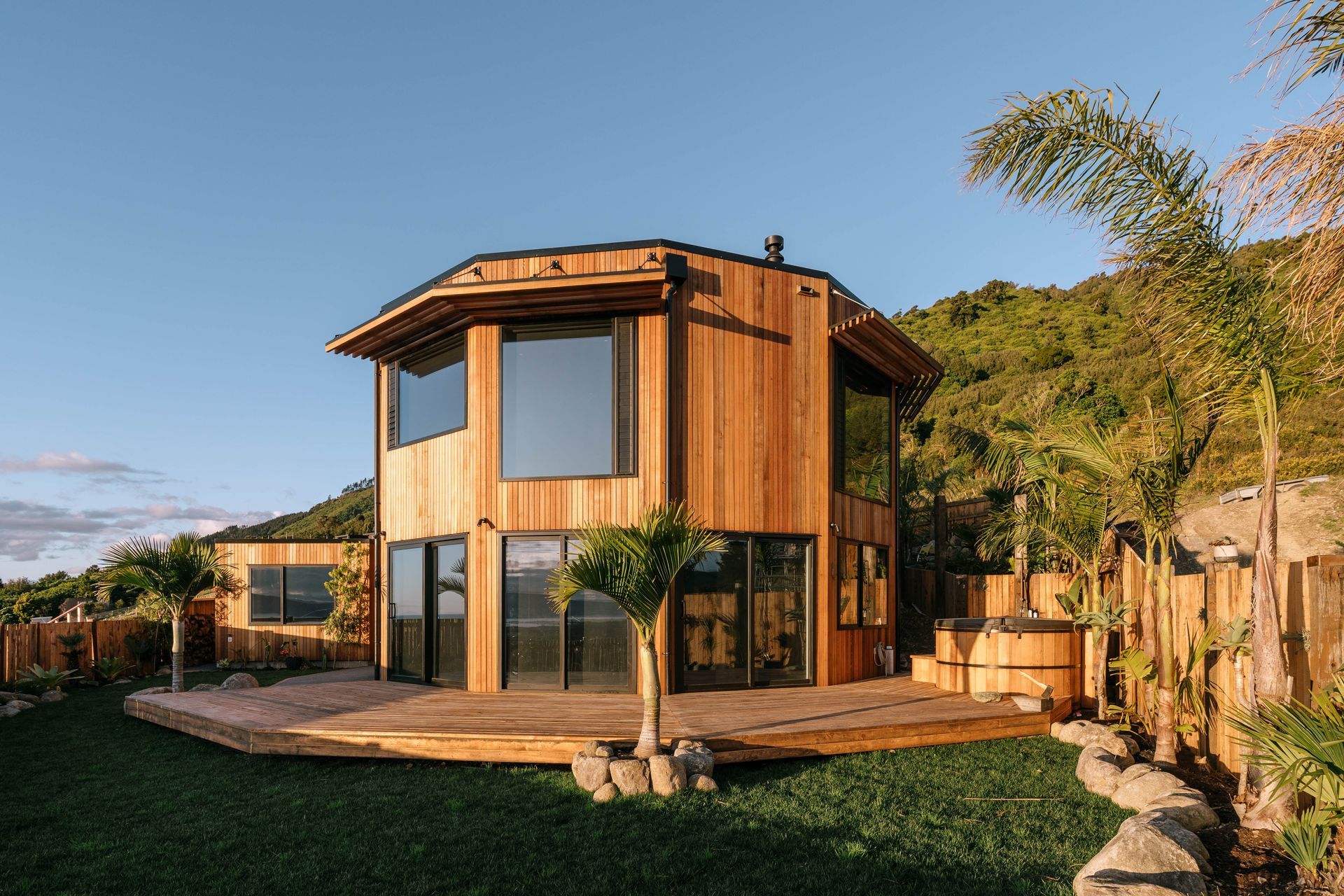 The spacious outdoor living area, complete with an outdoor shower and hot tub.