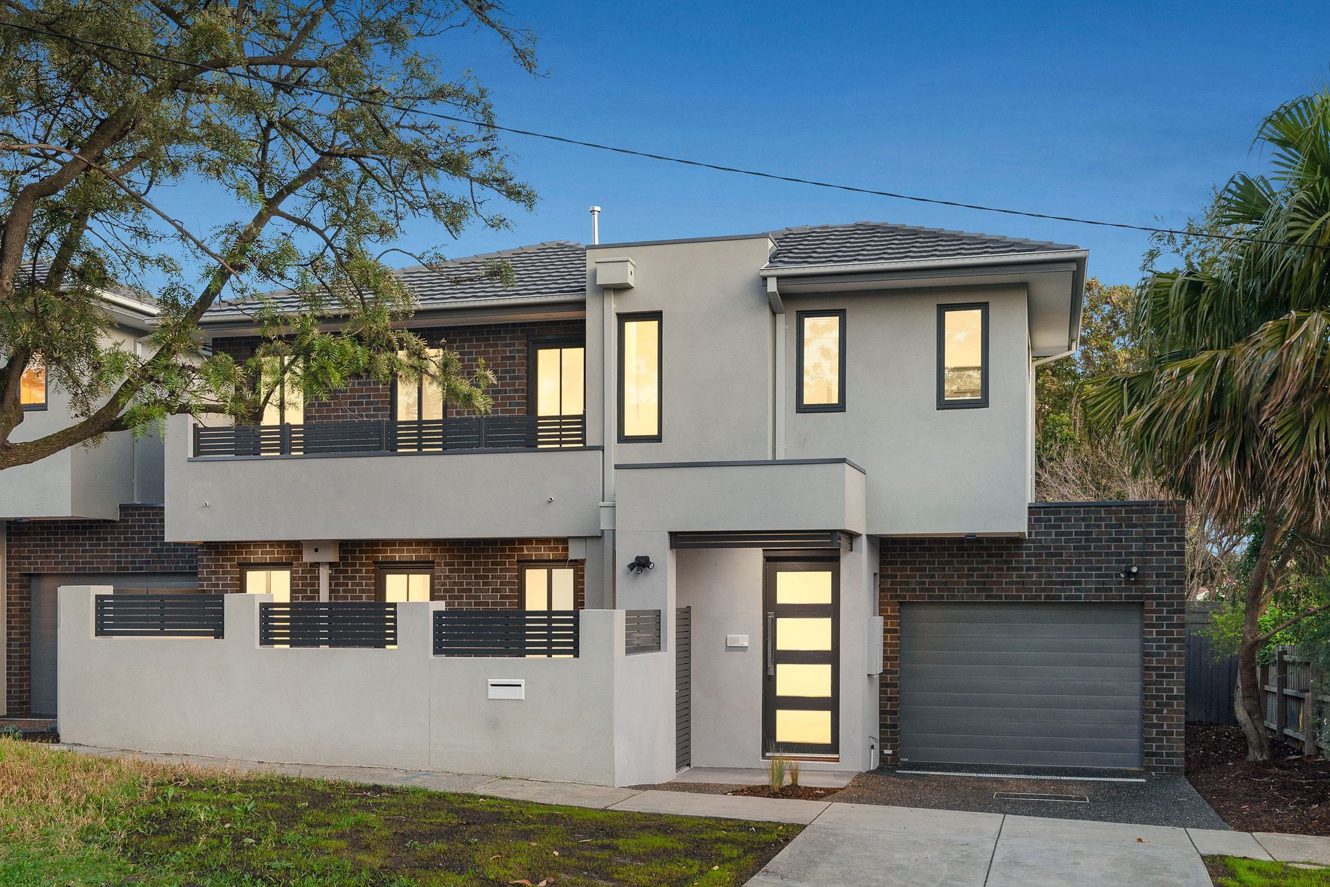 The dark brick exterior of this townhouse fits the suburban setting.