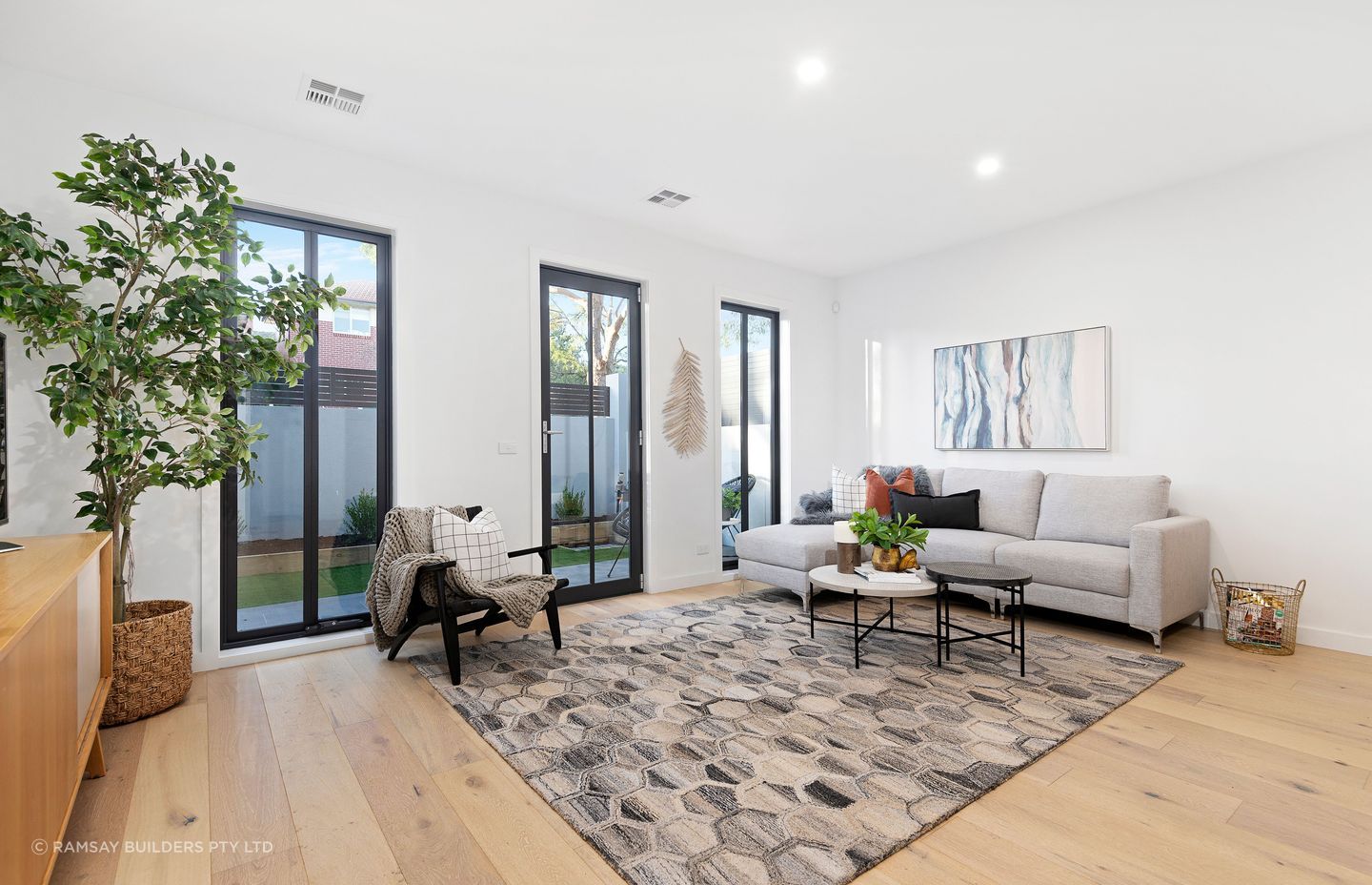 High ceilings and oak floorboards help create an airy, spacious environment.
