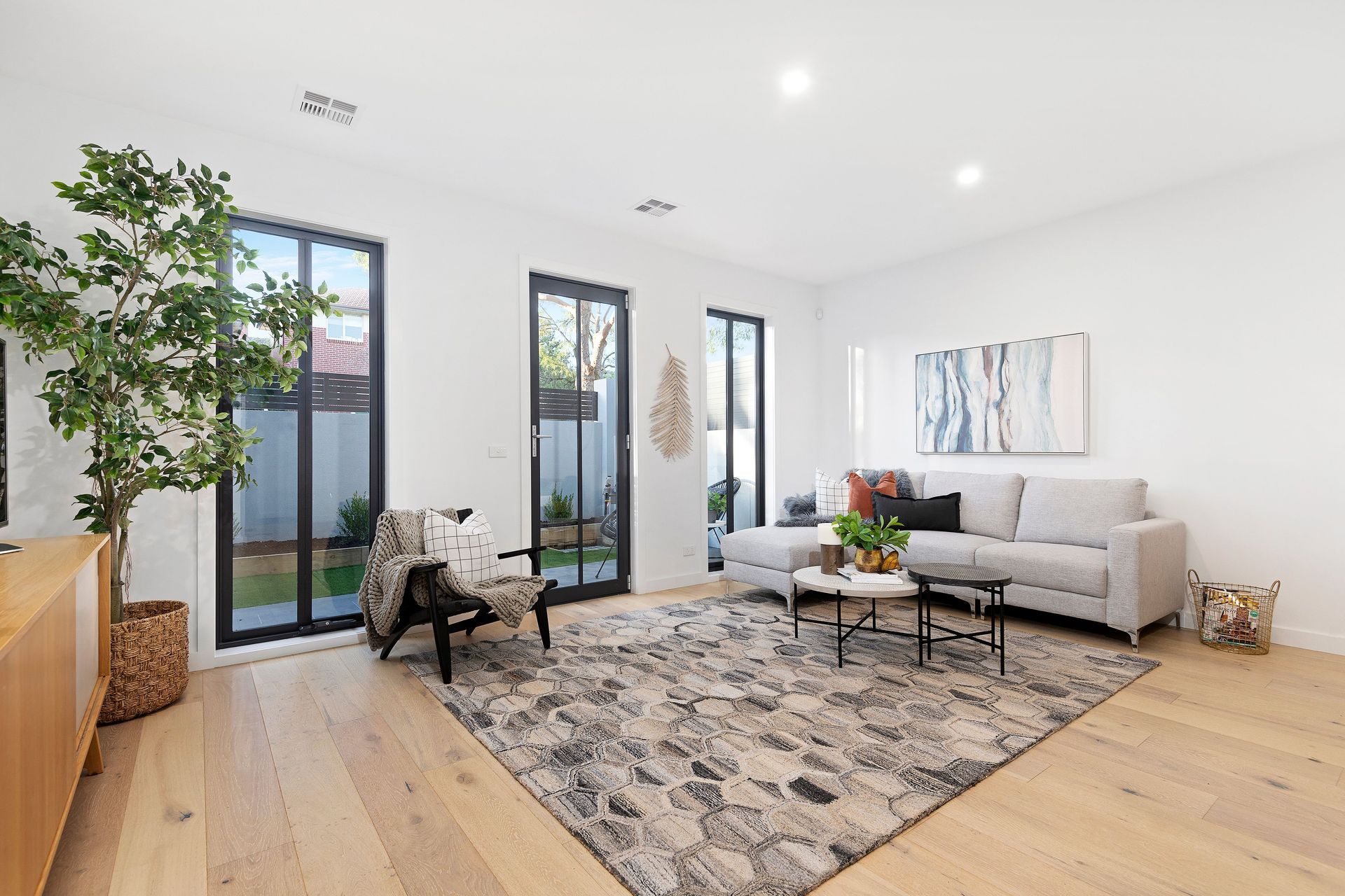High ceilings and oak floorboards help create an airy, spacious environment.