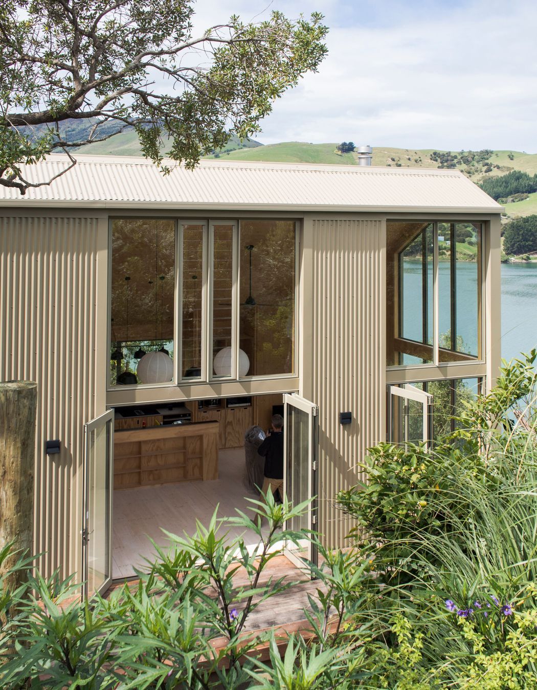 Blanks House in Robinson Bay, Christchurch, by Bonnifait + Giesen, is glazed to maximise sunlight from every direction. Photograph by Russell Kleyn.