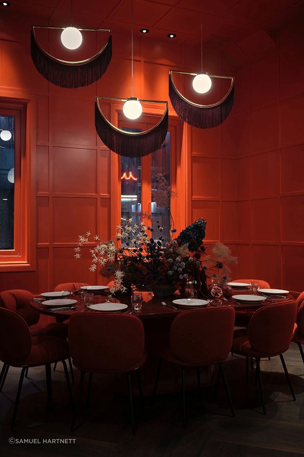 The pendants in the private dining room are by Houtique. “In the nick of time, they arrived pretty much the day before the opening,” says Toni.