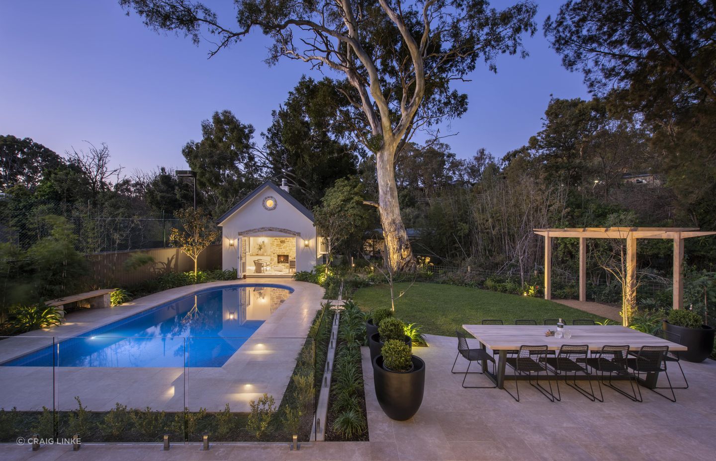 This glass pool fence protects not only the pool but also the stylish paving slabs. Featured project: The Pool Pavilion.