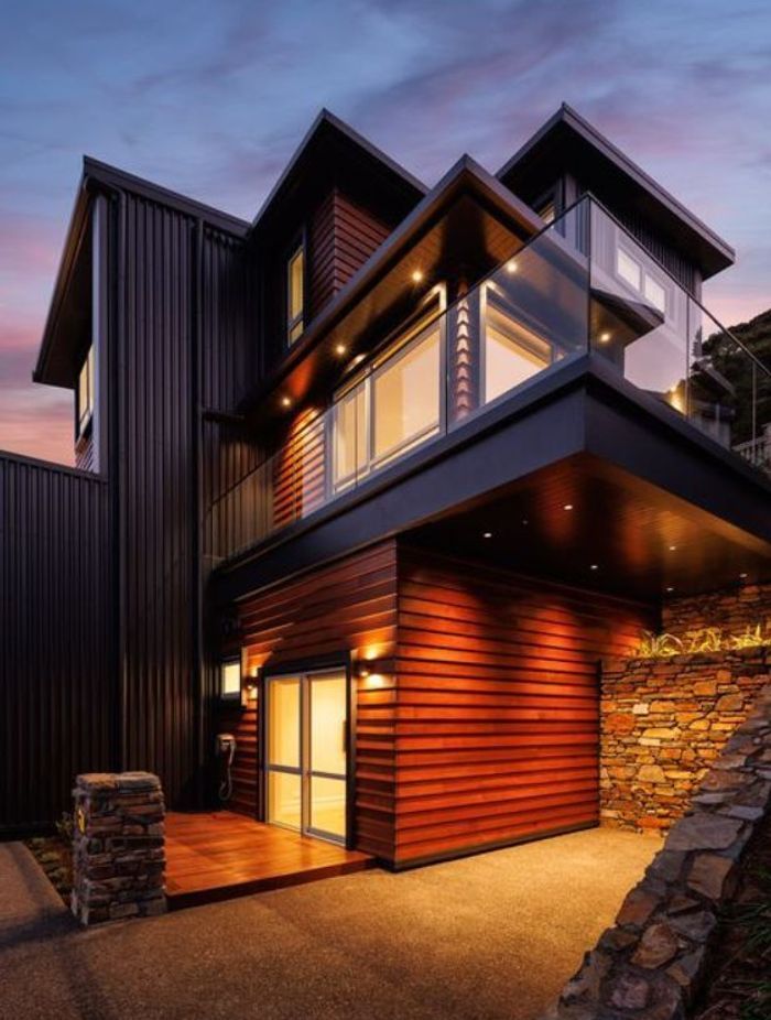 The home's exterior lighting evokes a sense of warmth and elegance