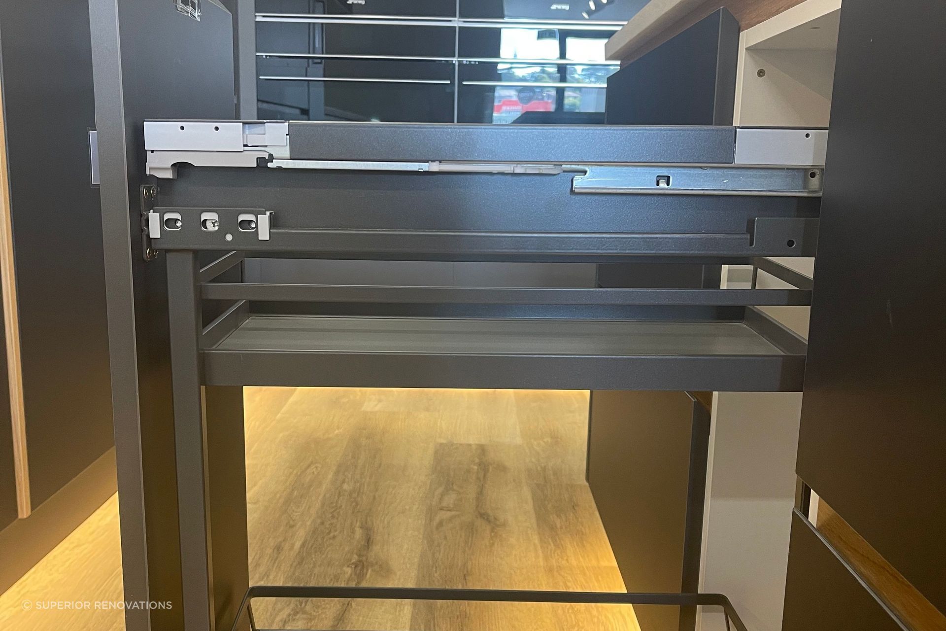 Pull out condiment cabinet in our kitchen showroom in Auckland
