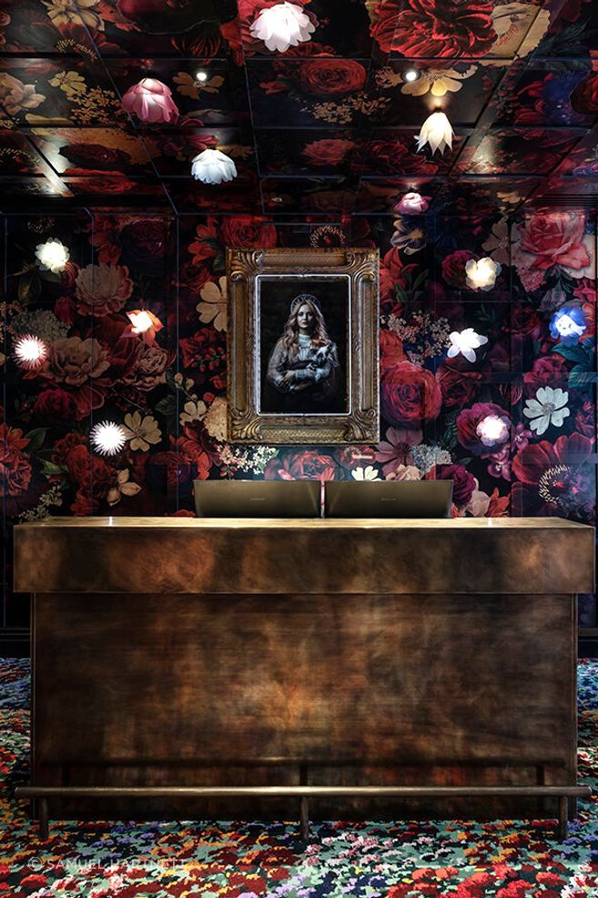 Material Creative weaves a tale from the moment guests step into reception, with rugs based on artwork by Karl Maughan by Designer Rugs. The floral and gold leaf wall mural was created by Haley Brown of The Art Dept and the photograph is by Ross Brown.