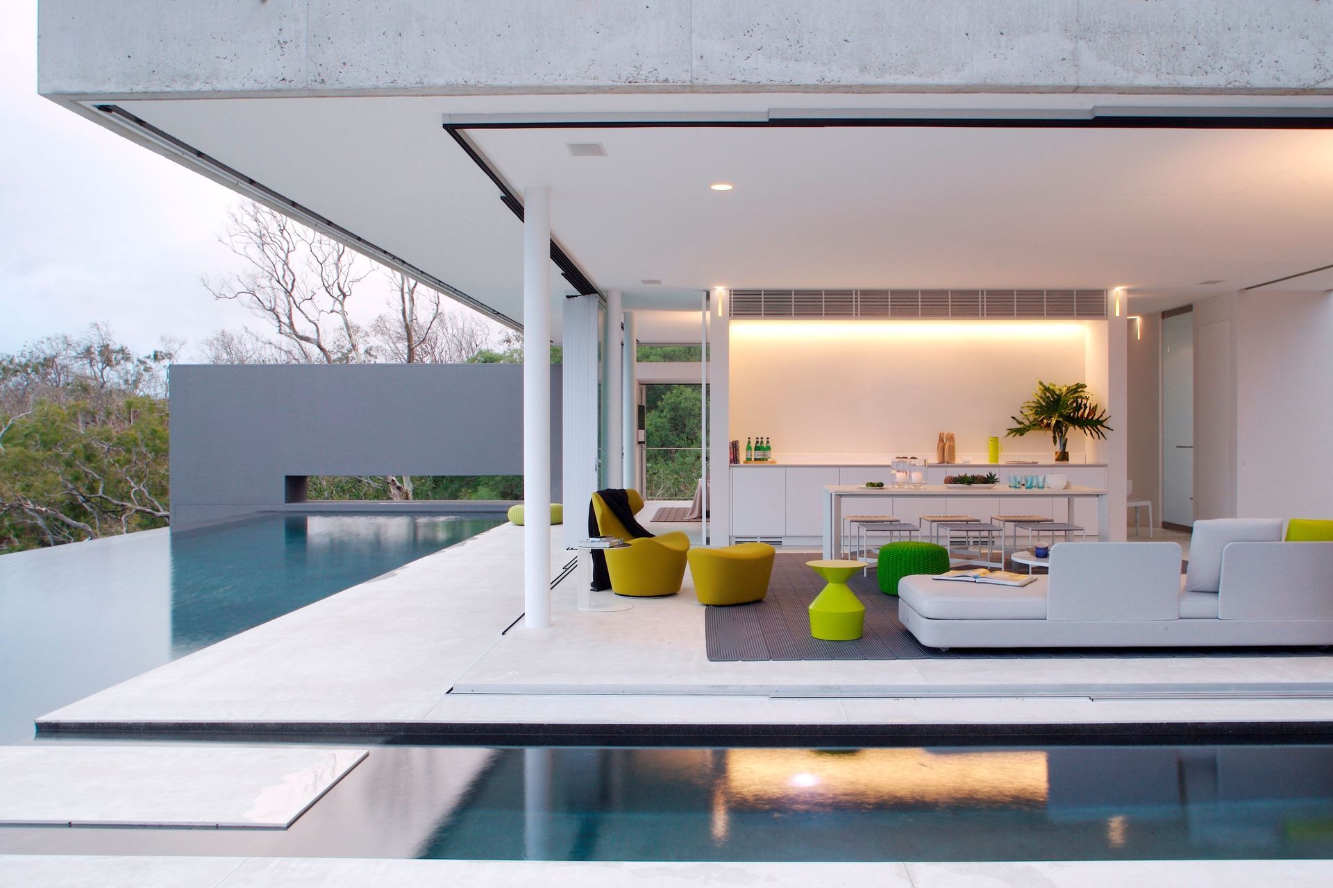 Azuris, Hamilton Island by Renato D'Ettorre Architects | Photography by Francesca Giovanelli - colourful furniture and an open plan design can give your backyard or pool area a relaxed feel.
