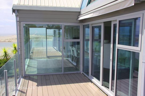 New Replacement Windows and Doors freshen up this stunning home in both aesthetics and improved options for ventilation.