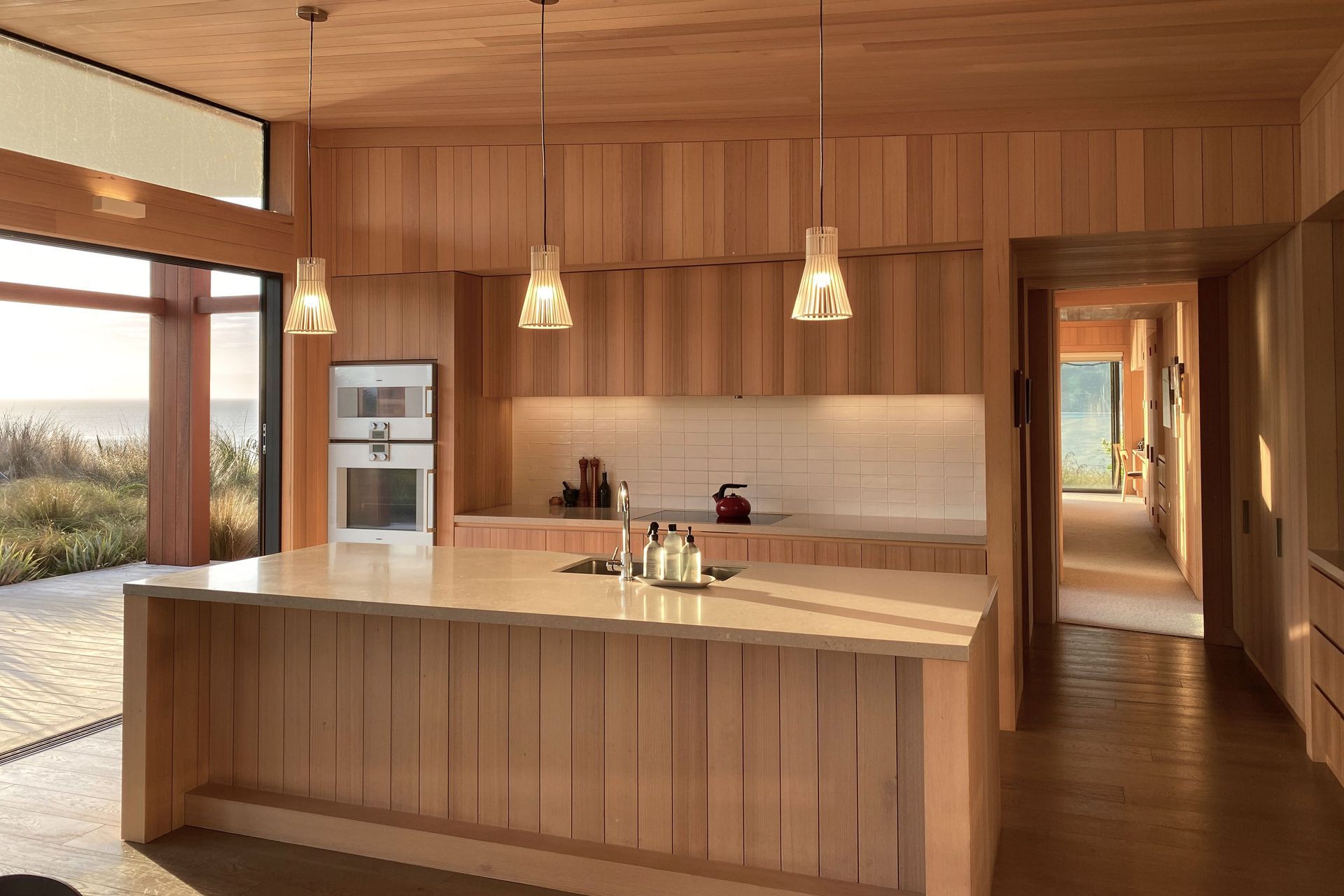 Coastal Retreat’s kitchen, clad in beautiful Tasmanian oak. | Photographer: Ruth Whitaker