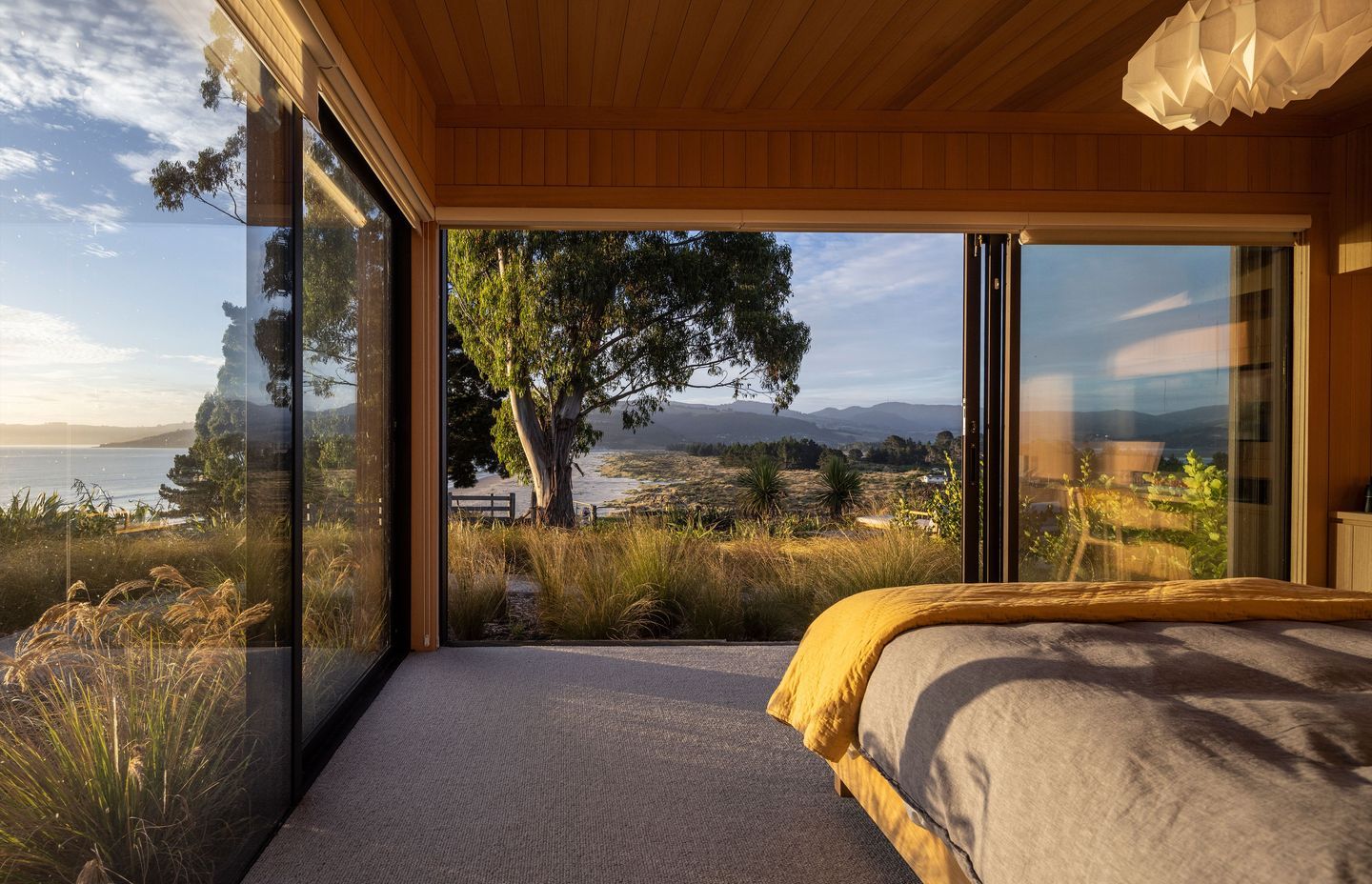 The master bedroom, overlooking Blueskin Bay. | Photographer: Graham Warman