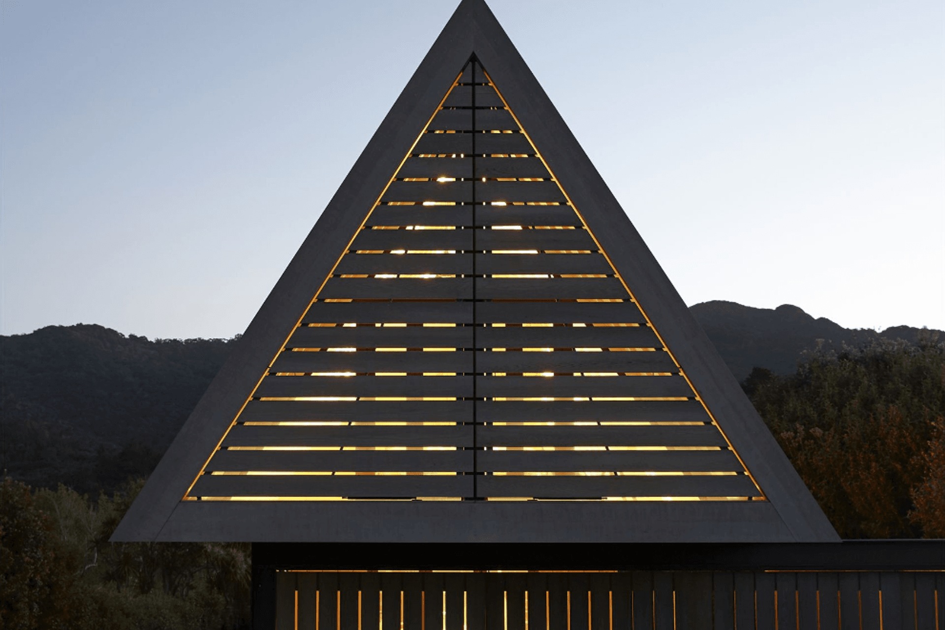 At night, when the dormer window shutters are closed, the triangle glows like a nautical beacon.